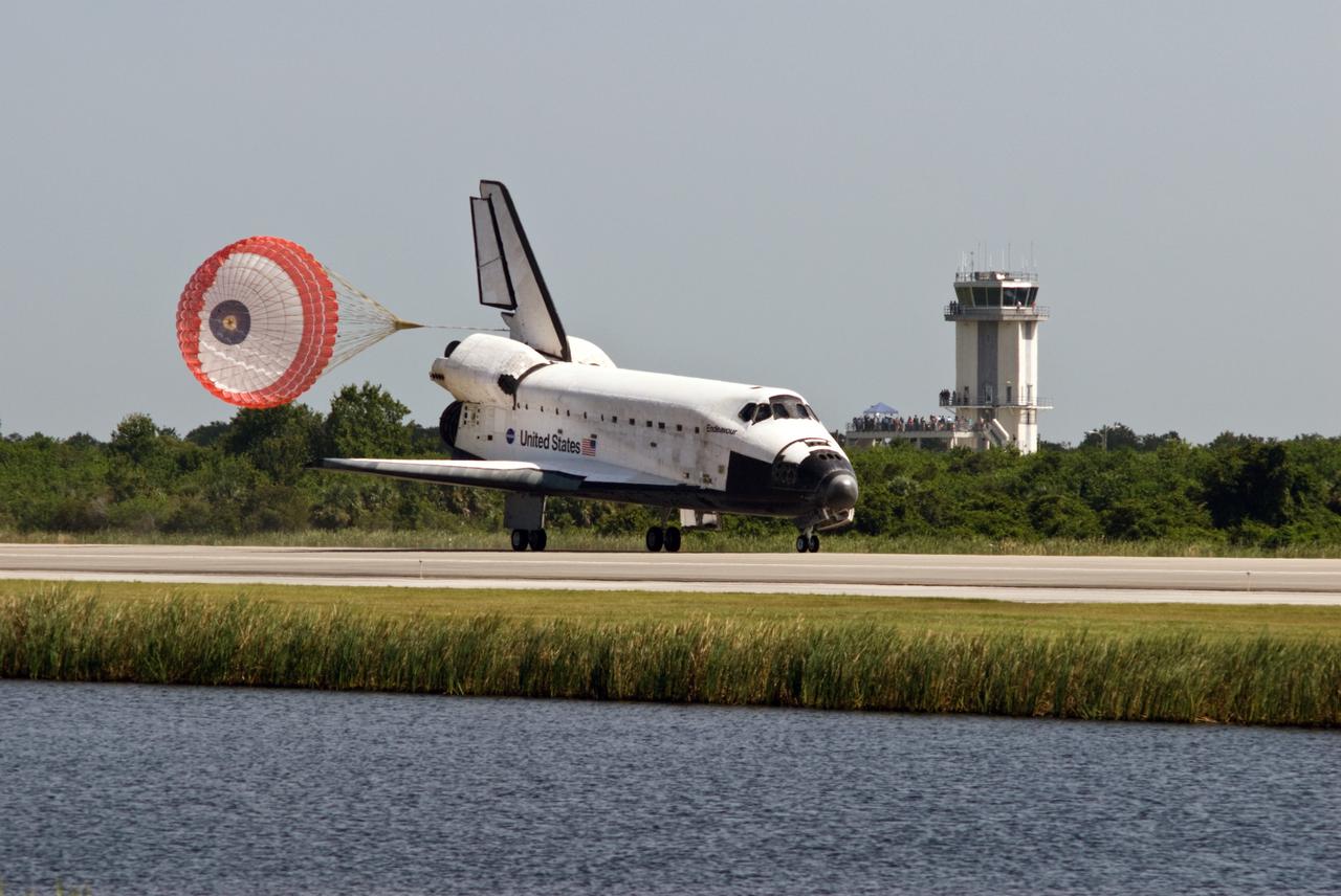 CAPE CANAVERAL, Fla. – Space shuttle Endeavour passes the control tower near Runway 15 at NASA's Kennedy Space Center in Florida as it lands to complete the 16-day, 6.5-million mile journey on the STS-127 mission to the International Space Station. Endeavour landed on orbit 248. Main gear touchdown was at 10:48:08 a.m. EDT. Nose gear touchdown was at 10:48:21 a.m. and wheels stop was at 10:49:13 a.m. Endeavour delivered the Japanese Experiment Module's Exposed Facility and the Experiment Logistics Module-Exposed Section to the International Space Station. The mission was the 29th flight to the station, the 23rd flight of Endeavour and the 127th in the Space Shuttle Program, as well as the 71st landing at Kennedy.  Photo credit: NASA/Rick Wetherington