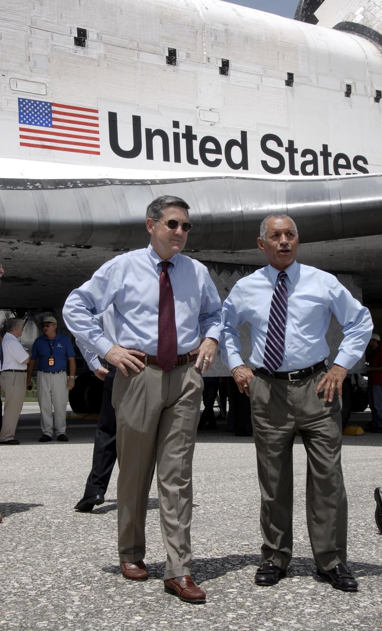 CAPE CANAVERAL, Fla. –  At NASA's Kennedy Space Center in Florida, Center Director Bob Cabana (left) and NASA Administrator Charles Bolden wait near space shuttle Endeavour for the STS-127 crew to emerge from the crew transport vehicle.  Endeavour's landing completed the 16-day, 6.5-million mile journey on the STS-127 mission to the International Space Station.  Main gear touchdown was at 10:48:08 a.m. EDT. Nose gear touchdown was at 10:48:21 a.m. and wheels stop was at 10:49:13 a.m. Endeavour delivered the Japanese Experiment Module's Exposed Facility and the Experiment Logistics Module-Exposed Section to the International Space Station. The mission was the 29th flight to the station, the 23rd flight of Endeavour and the 127th in the Space Shuttle Program, as well as the 71st landing at Kennedy.   Photo credit: NASA/Kim Shiflett