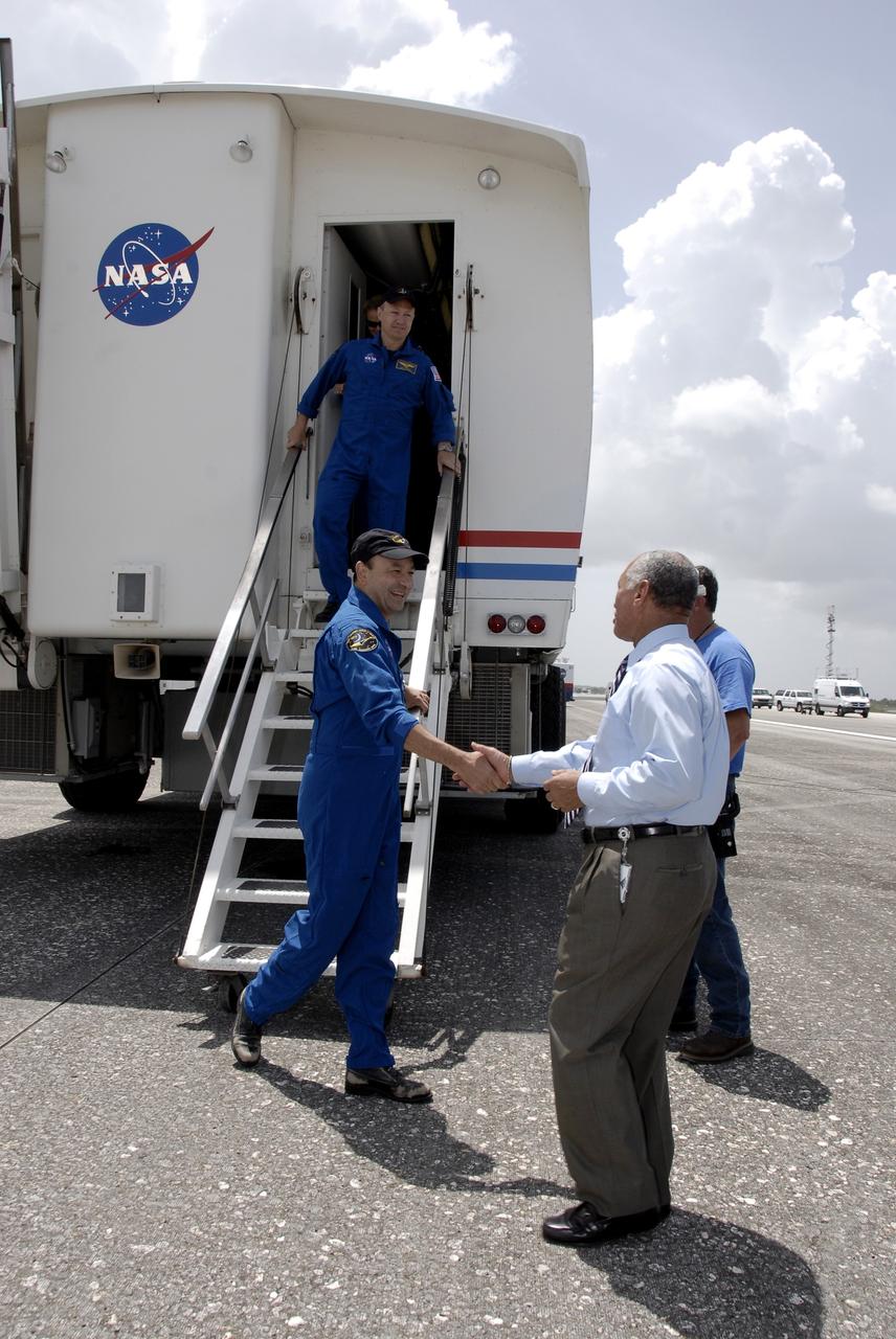 CAPE CANAVERAL, Fla. –  Exiting from the crew transport vehicle at NASA's Kennedy Space Center in Florida, STS-127 Commander Mark Polansky is greeted by NASA Administrator Charles Bolden.  Behind Polansky is Pilot Doug Hurley.  The crew returned to Earth on space shuttle Endeavour to complete the 16-day, 6.5-million mile journey on the STS-127 mission to the International Space Station.  Main gear touchdown was at 10:48:08 a.m. EDT. Nose gear touchdown was at 10:48:21 a.m. and wheels stop was at 10:49:13 a.m. Endeavour delivered the Japanese Experiment Module's Exposed Facility and the Experiment Logistics Module-Exposed Section to the International Space Station. The mission was the 29th flight to the station, the 23rd flight of Endeavour and the 127th in the Space Shuttle Program, as well as the 71st landing at Kennedy.   Photo credit: NASA/Kim Shiflett