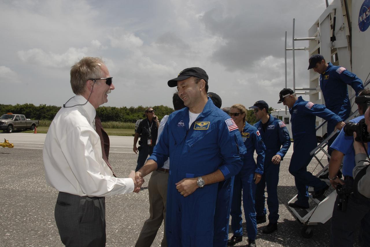 CAPE CANAVERAL, Fla. –  At NASA's Kennedy Space Center in Florida, STS-127 crew members are greeted by NASA officials.  From left are Associate Administrator for Space Operations  William Gerstenmaier, Commander Mark Polansky, Mission Specialists Julie Payette, Tom Marshburn, Dave Wolf and Christopher Cassidy. The crew returned to Earth on space shuttle Endeavour to complete the 16-day, 6.5-million mile journey on the STS-127 mission to the International Space Station.  Main gear touchdown was at 10:48:08 a.m. EDT. Nose gear touchdown was at 10:48:21 a.m. and wheels stop was at 10:49:13 a.m. Endeavour delivered the Japanese Experiment Module's Exposed Facility and the Experiment Logistics Module-Exposed Section to the International Space Station. The mission was the 29th flight to the station, the 23rd flight of Endeavour and the 127th in the Space Shuttle Program, as well as the 71st landing at Kennedy.   Photo credit: NASA/Kim Shiflett