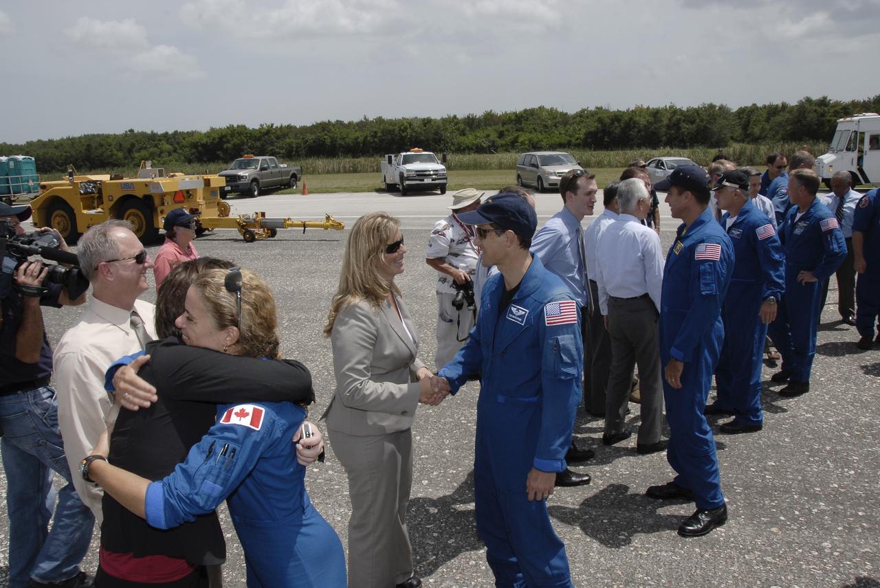 CAPE CANAVERAL, Fla. – At NASA's Kennedy Space Center in Florida, STS-127 crew members are greeted by NASA officials. From left are STS-127 Launch Director Pete Nickolenko, Mission Specialist Julie Payette, Endeavour Flow Director Dana Hutcherson, Mission Specialist Tom Marshburn, Chief of Staff in the Office of the Administrator George Whitesides, President of the Japan Aerospace Exploration Agency Keiji Tachikawa (back to camera), Mission Specialists Christopher Cassidy and Dave Wolf, Kennedy Center Director Bob Cabana and astronaut Steven Lindsey. The crew returned to Earth on space shuttle Endeavour to complete the 16-day, 6.5-million mile journey on the STS-127 mission to the International Space Station. Endeavour's main gear touchdown was at 10:48:08 a.m. EDT. Nose gear touchdown was at 10:48:21 a.m. and wheels stop was at 10:49:13 a.m. Endeavour delivered the Japanese Experiment Module's Exposed Facility and the Experiment Logistics Module-Exposed Section to the International Space Station. The mission was the 29th flight to the station, the 23rd flight of Endeavour and the 127th in the Space Shuttle Program, as well as the 71st landing at Kennedy. Photo credit: NASA/Kim Shiflett