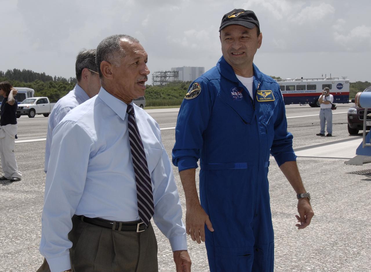 CAPE CANAVERAL, Fla. –  At NASA's Kennedy Space Center in Florida, NASA Administrator Charles Bolden walks with STS-127 Commander Mark Polansky after space shuttle Endeavour's landing that completed the 16-day, 6.5-million mile journey on the STS-127 mission to the International Space Station.  Behind Bolden is Center Director Bob Cabana. Main gear touchdown was at 10:48:08 a.m. EDT. Nose gear touchdown was at 10:48:21 a.m. and wheels stop was at 10:49:13 a.m. Endeavour delivered the Japanese Experiment Module's Exposed Facility and the Experiment Logistics Module-Exposed Section to the International Space Station. The mission was the 29th flight to the station, the 23rd flight of Endeavour and the 127th in the Space Shuttle Program, as well as the 71st landing at Kennedy.   Photo credit: NASA/Kim Shiflett