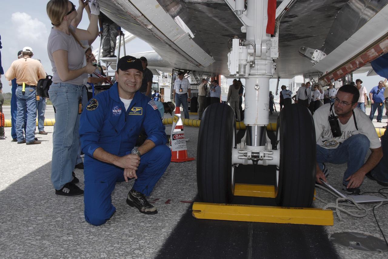 CAPE CANAVERAL, Fla. –  STS-127 Commander Mark Polansky kneels next to the landing gear on space shuttle Endeavour.  He and other crew members returned to Earth on Endeavour to complete the 16-day, 6.5-million mile journey on the STS-127 mission to the International Space Station. Main gear touchdown was at 10:48:08 a.m. EDT. Nose gear touchdown was at 10:48:21 a.m. and wheels stop was at 10:49:13 a.m. Endeavour delivered the Japanese Experiment Module's Exposed Facility and the Experiment Logistics Module-Exposed Section to the International Space Station. The mission was the 29th flight to the station, the 23rd flight of Endeavour and the 127th in the Space Shuttle Program, as well as the 71st landing at Kennedy.   Photo credit: NASA/Kim Shiflett