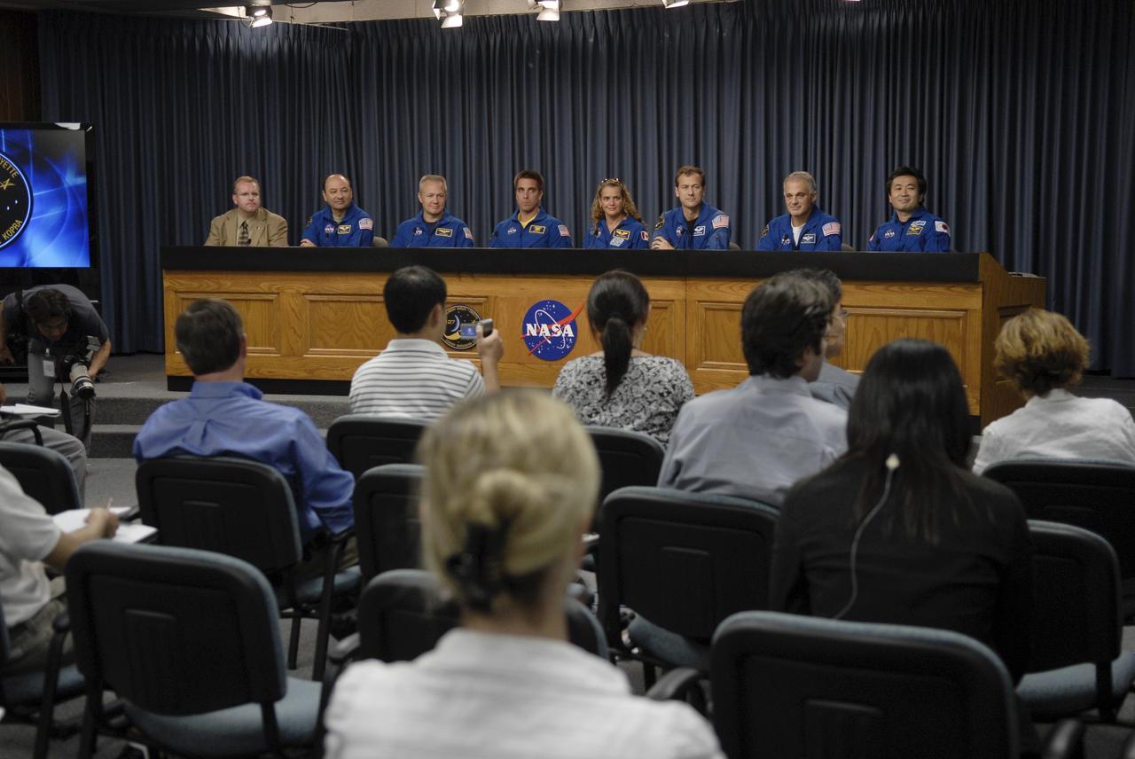 CAPE CANAVERAL, Fla. – At  NASA's Kennedy Space Center in Florida, the STS-127 crew members take part in a news conference following their return to Earth on space shuttle Endeavour after the 16-day mission to the International Space Station.  From left are NASA Public Affairs Officer Allard Beutel, Commander Mark Polansky, Pilot Doug Hurley, Mission Specialists Christopher Cassidy, Canadian Space Agency astronaut Julie Payette, Tom Marshburn and Dave Wolf, and Japan Aerospace Exploration Agency astronaut Koichi Wakata, who spent four months on the space station and returned on Endeavour.  Endeavour delivered the Japanese Experiment Module's Exposed Facility and the Experiment Logistics Module-Exposed Section to the International Space Station. The mission was the 29th flight to the station, the 23rd flight of Endeavour and the 127th in the Space Shuttle Program, as well as the 71st landing at Kennedy.  Photo credit: NASA/Kim Shiflett