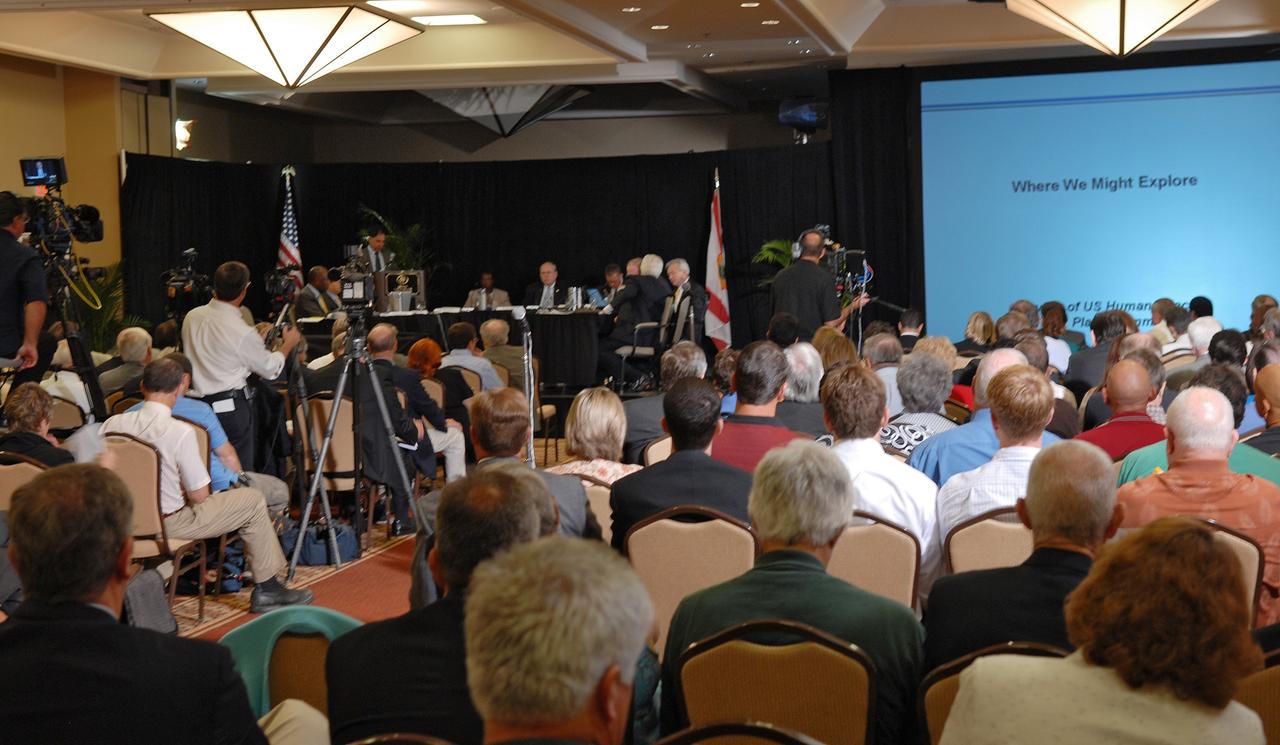 CAPE CANAVERAL, Fla. –  – Photographers and spectators show their interest in the Augustine Commission, meeting in Cocoa Beach, Fla.  At the request of the Office of Science and Technology Policy, NASA established the Review of U.S. Human Space Flight Plans Committee, known as the Augustine Commission.  Chaired by  Norman R. Augustine, retired chairman and CEO of Lockheed Martin Corp.,  the committee is conducting an independent review of ongoing U.S. human spaceflight plans and programs, as well as alternatives, to ensure the nation is pursuing the best trajectory for the future of human space flight - one that is safe, innovative, affordable, and sustainable.  Photo credit: NASA/Jim Grossmann