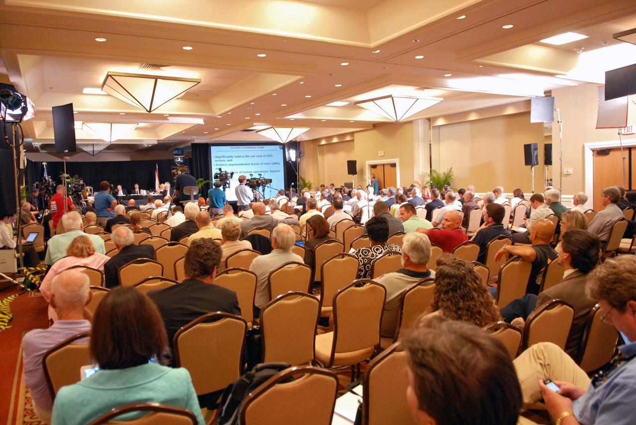 CAPE CANAVERAL, Fla. –  Photographers and spectators show their interest in the Augustine Commission, meeting in Cocoa Beach, Fla.  At the request of the Office of Science and Technology Policy, NASA established the Review of U.S. Human Space Flight Plans Committee, known as the Augustine Commission.  Chaired by  Norman R. Augustine, retired chairman and CEO of Lockheed Martin Corp.,  the committee is conducting an independent review of ongoing U.S. human spaceflight plans and programs, as well as alternatives, to ensure the nation is pursuing the best trajectory for the future of human space flight - one that is safe, innovative, affordable, and sustainable.  Photo credit: NASA/Jim Grossmann