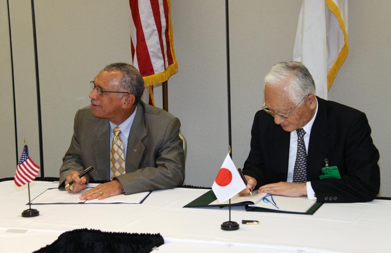 CAPE CANAVERAL, Fla. – NASA Administrator Charles Bolden (left) and Japan Aerospace Exploration Agency, or JAXA, President Keiji Tachikawa sign an agreement defining the terms of cooperation between the agencies on the Global Precipitation Measurement, or GPM, mission. The ceremony took place July 30 at the Kennedy Space Center Visitor Complex, Fla. Through the agreement, NASA is responsible for the GPM core observatory spacecraft bus, the GPM Microwave Imager, or GMI, carried by it, and a second GMI to be flown on a partner-provided Low-Inclination Observatory. JAXA will supply the Dual-frequency Precipitation Radar for the core observatory, an H-IIA rocket for the core observatory's launch in July 2013, and data from a conical-scanning microwave imager on the upcoming Global Change Observation Mission satellite. Photo credit: NASA/Jack Pfaller