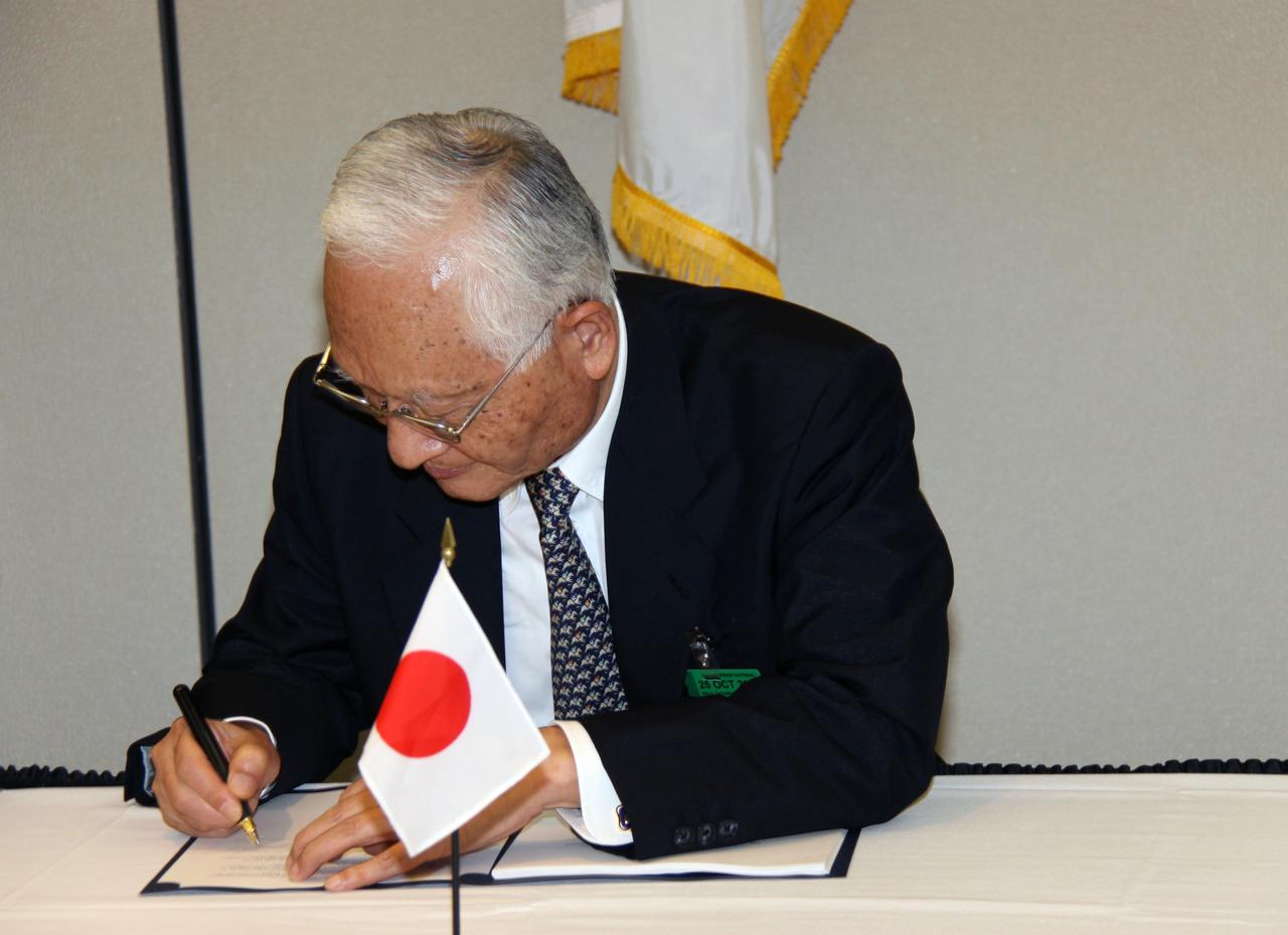 CAPE CANAVERAL, Fla. – Japan Aerospace Exploration Agency, or JAXA, President Keiji Tachikawa signs an agreement defining the terms of cooperation between NASA and JAXA on the Global Precipitation Measurement, or GPM, mission. The ceremony took place July 30 at the Kennedy Space Center Visitor Complex, Fla. Through the agreement, NASA is responsible for the GPM core observatory spacecraft bus, the GPM Microwave Imager, or GMI, carried by it, and a second GMI to be flown on a partner-provided Low-Inclination Observatory. JAXA will supply the Dual-frequency Precipitation Radar for the core observatory, an H-IIA rocket for the core observatory's launch in July 2013, and data from a conical-scanning microwave imager on the upcoming Global Change Observation Mission satellite. Photo credit: NASA/Jack Pfaller