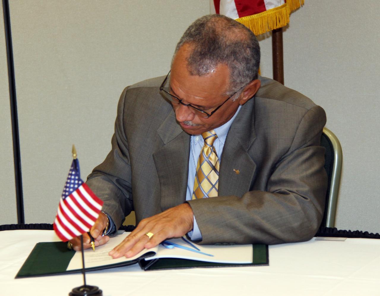 CAPE CANAVERAL, Fla. – NASA Administrator Charles Bolden signs an agreement defining the terms of cooperation between NASA and JAXA on the Global Precipitation Measurement, or GPM, mission. The ceremony took place July 30 at the Kennedy Space Center Visitor Complex, Fla. Through the agreement, NASA is responsible for the GPM core observatory spacecraft bus, the GPM Microwave Imager, or GMI, carried by it, and a second GMI to be flown on a partner-provided Low-Inclination Observatory. JAXA will supply the Dual-frequency Precipitation Radar for the core observatory, an H-IIA rocket for the core observatory's launch in July 2013, and data from a conical-scanning microwave imager on the upcoming Global Change Observation Mission satellite. Photo credit: NASA/Jack Pfaller