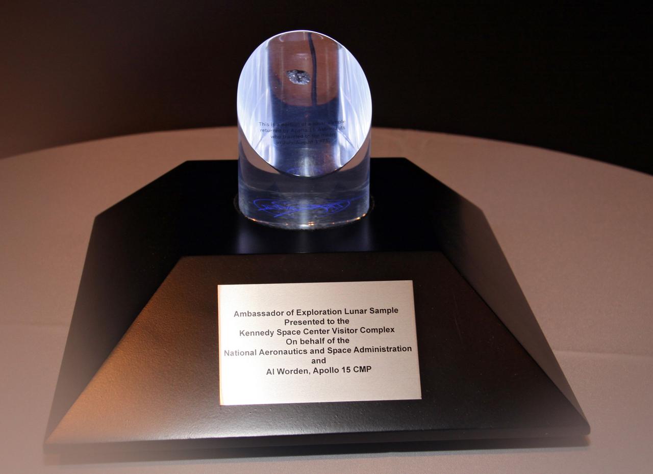 CAPE CANAVERAL, Fla. – NASA will honor Apollo astronaut Al Worden with the presentation of this Ambassador of Exploration Award, a moon rock encased in Lucite, mounted for public display.  He is being honored for his contributions to the U.S. space program. Worden received the award during a ceremony July 30 at the Apollo Saturn V Center at NASA's Kennedy Space Center Visitor Complex in Florida, where the moon rock will be displayed. Worden served as command module pilot for the Apollo 15 mission, which set several moon records for NASA, including the longest lunar surface stay time, the longest lunar extravehicular activity and the first use of a lunar roving vehicle. Worden spent 38 minutes in a spacewalk outside the command module and logged a total of 295 hours, 11 minutes in space during the mission. NASA is giving the Ambassador of Exploration Award to the first generation of explorers in the Mercury, Gemini and Apollo space programs for realizing America's goal of going to the moon. The rock is part of the 842 pounds of lunar samples collected during six Apollo expeditions from 1969 to 1972. Those astronauts who receive the award will then present the award to a museum of their choice. Photo credit: NASA/Jack Pfaller