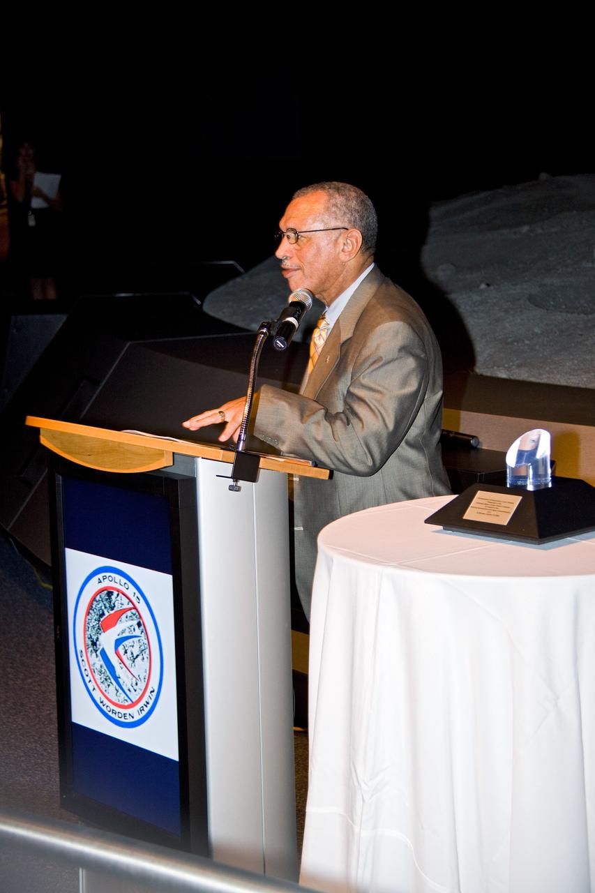 CAPE CANAVERAL, Fla. – At NASA's Kennedy Space Center in Florida, NASA Administrator Charles Bolden addresses guests who have gathered in Kennedy's Visitor Complex to celebrate Apollo astronaut Al Worden's receiving the Ambassador of Exploration Award. Worden is being honored for his contributions to the U.S. space program. The award, to be displayed at Kennedy, is a moon rock encased in Lucite, mounted for public display. Worden served as command module pilot for the Apollo 15 mission, which set several moon records for NASA, including the longest lunar surface stay time, the longest lunar extravehicular activity and the first use of a lunar roving vehicle. Worden spent 38 minutes in a spacewalk outside the command module and logged a total of 295 hours, 11 minutes in space during the mission. NASA is giving the Ambassador of Exploration Award to the first generation of explorers in the Mercury, Gemini and Apollo space programs for realizing America's goal of going to the moon. The rock is part of the 842 pounds of lunar samples collected during six Apollo expeditions from 1969 to 1972. Those astronauts who receive the award will then present the award to a museum of their choice. Photo credit: NASA/Jack Pfaller