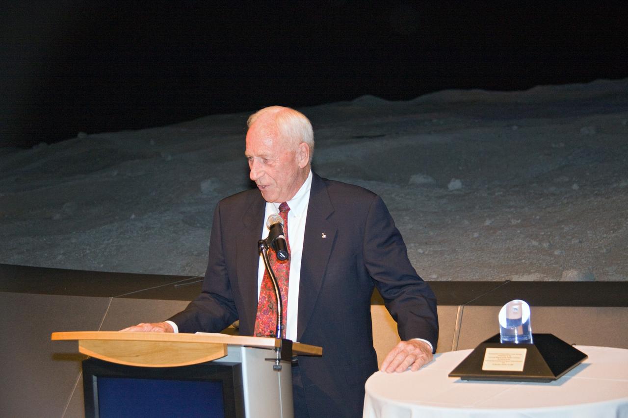 CAPE CANAVERAL, Fla. – At NASA Kennedy Space Center's Visitor Complex in Florida, Apollo astronaut Al Worden shares his thoughts about the Space Program after receiving the Ambassador of Exploration Award. Worden is being honored for his contributions to the U.S. space program. A moon rock encased in Lucite, the award is seen at right and will be displayed at Kennedy. Worden served as command module pilot for the Apollo 15 mission, which set several moon records for NASA, including the longest lunar surface stay time, the longest lunar extravehicular activity and the first use of a lunar roving vehicle. Worden spent 38 minutes in a spacewalk outside the command module and logged a total of 295 hours, 11 minutes in space during the mission. NASA is giving the Ambassador of Exploration Award to the first generation of explorers in the Mercury, Gemini and Apollo space programs for realizing America's goal of going to the moon. The rock is part of the 842 pounds of lunar samples collected during six Apollo expeditions from 1969 to 1972. Those astronauts who receive the award will then present the award to a museum of their choice. Photo credit: NASA/Jack Pfaller
