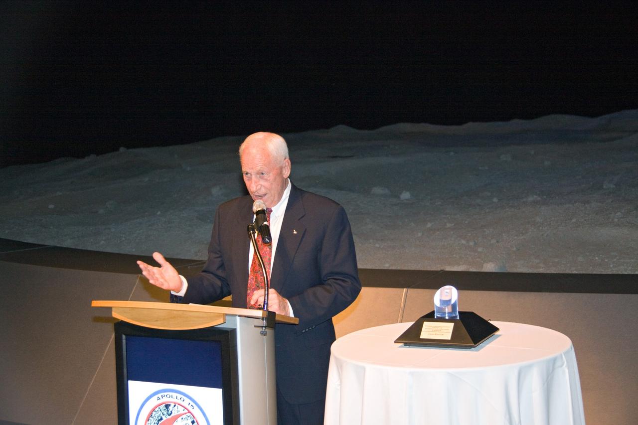 CAPE CANAVERAL, Fla. – At NASA Kennedy Space Center's Visitor Complex in Florida, Apollo astronaut Al Worden shares his thoughts about the Space Program after receiving the Ambassador of Exploration Award. Worden is being honored for his contributions to the U.S. space program. A moon rock encased in Lucite, the award is seen at right and will be displayed at Kennedy. Worden served as command module pilot for the Apollo 15 mission, which set several moon records for NASA, including the longest lunar surface stay time, the longest lunar extravehicular activity and the first use of a lunar roving vehicle. Worden spent 38 minutes in a spacewalk outside the command module and logged a total of 295 hours, 11 minutes in space during the mission. NASA is giving the Ambassador of Exploration Award to the first generation of explorers in the Mercury, Gemini and Apollo space programs for realizing America's goal of going to the moon. The rock is part of the 842 pounds of lunar samples collected during six Apollo expeditions from 1969 to 1972. Those astronauts who receive the award will then present the award to a museum of their choice. Photo credit: NASA/Jack Pfaller