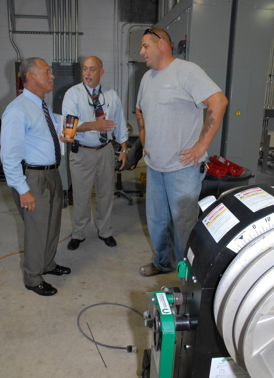 CAPE CANAVERAL, Fla. – NASA Administrator Charles Bolden (left) stops in the Launch Equipment Test Facility, or LETF, during his tour of NASA's Kennedy Space Center in Florida.  At center is Eric Ernst, Kennedy LETF manager. Bolden is touring several facilities at Kennedy involved with NASA's  Constellation Program. Bolden also was at Kennedy for several events, including the landing of space shuttle Endeavour's STS-127 mission and the signing of the joint NASA-Japan Aerospace Exploration Agency agreement defining the terms of cooperation between the agencies on the Global Precipitation Measurement, or GPM, mission.  Photo credit: NASA/Kim Shiflett