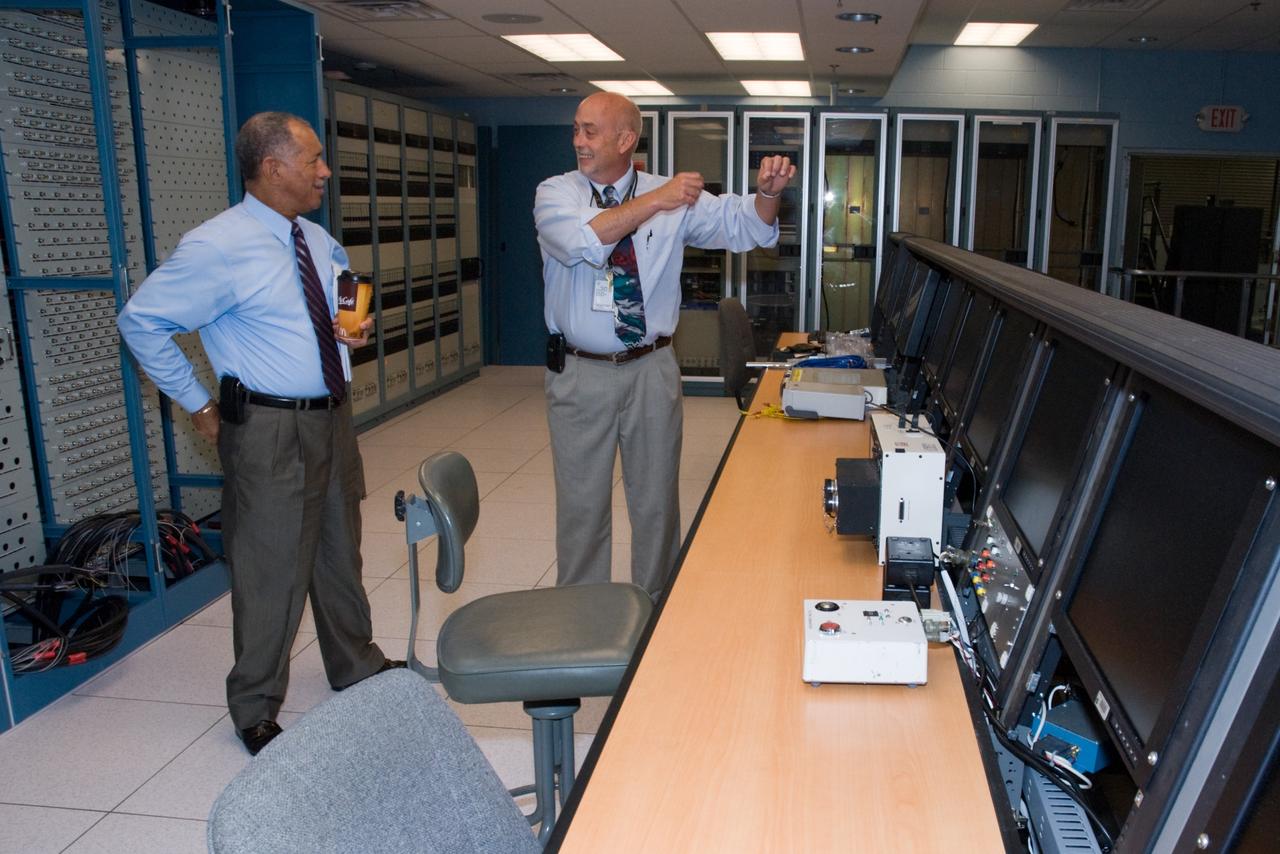 CAPE CANAVERAL, Fla. – NASA Administrator Charles Bolden (left) stops in the Launch Equipment Test Facility, or LETF, Vehicle Motion Simulator control room at NASA's Kennedy Space Center in Florida.  At right is Eric Ernst, Kennedy LETF manager.  Bolden is touring several facilities at Kennedy involved with NASA's  Constellation Program. Bolden also was at Kennedy for several events, including the landing of space shuttle Endeavour's STS-127 mission and the signing of the joint NASA-Japan Aerospace Exploration Agency agreement defining the terms of cooperation between the agencies on the Global Precipitation Measurement, or GPM, mission.  Photo credit: NASA/Kim Shiflett