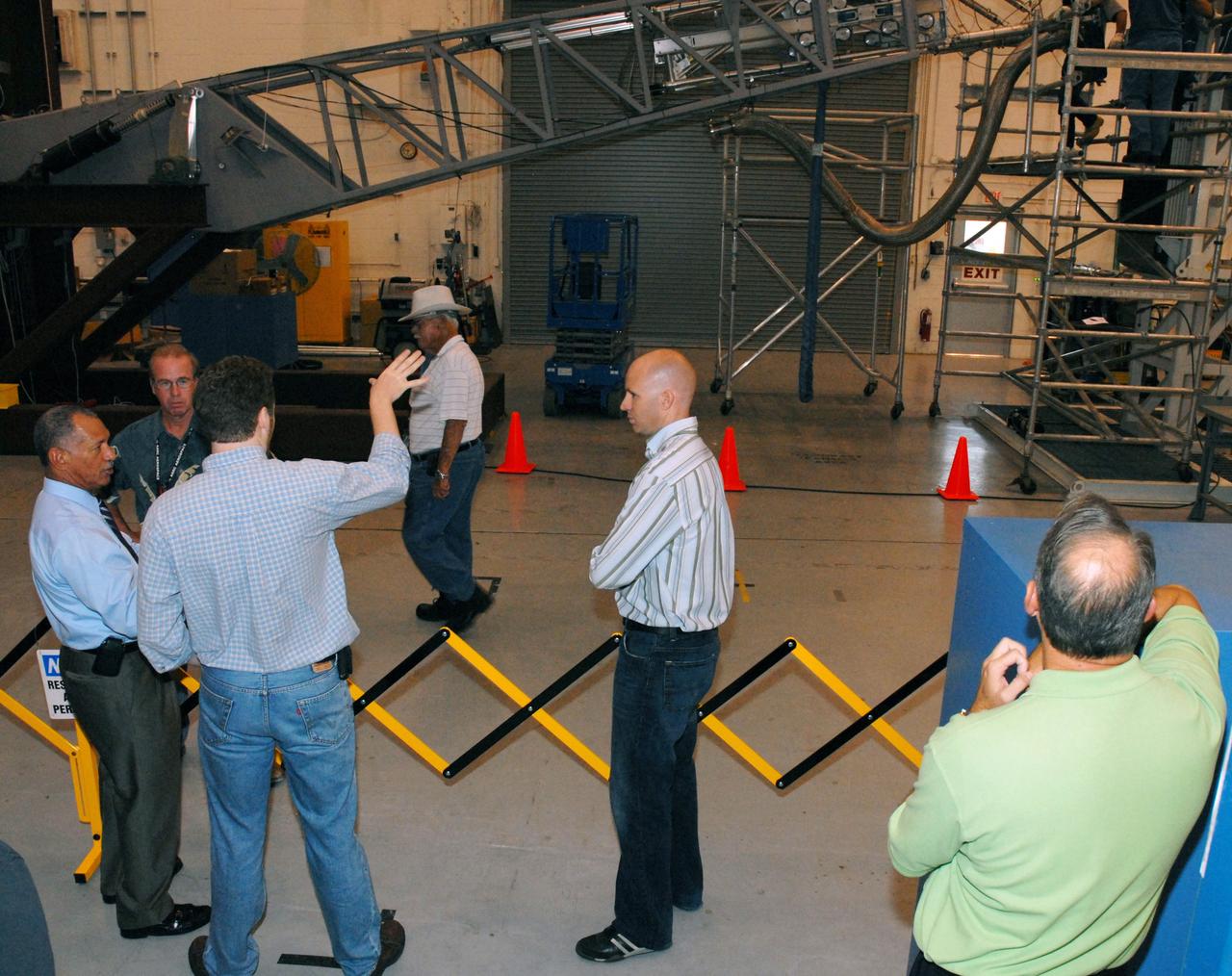 CAPE CANAVERAL, Fla. – In the Launch Equipment Test Facility at NASA's Kennedy Space Center in Florida, NASA Administrator Charles Bolden (far left) learns about the demonstration about to start on the umbilical line for Constellation test equipment. Bolden is touring several facilities at Kennedy involved with NASA's  Constellation Program. Bolden also was at Kennedy for several events, including the landing of space shuttle Endeavour's STS-127 mission and the signing of the joint NASA-Japan Aerospace Exploration Agency agreement defining the terms of cooperation between the agencies on the Global Precipitation Measurement, or GPM, mission.  Photo credit: NASA/Kim Shiflett