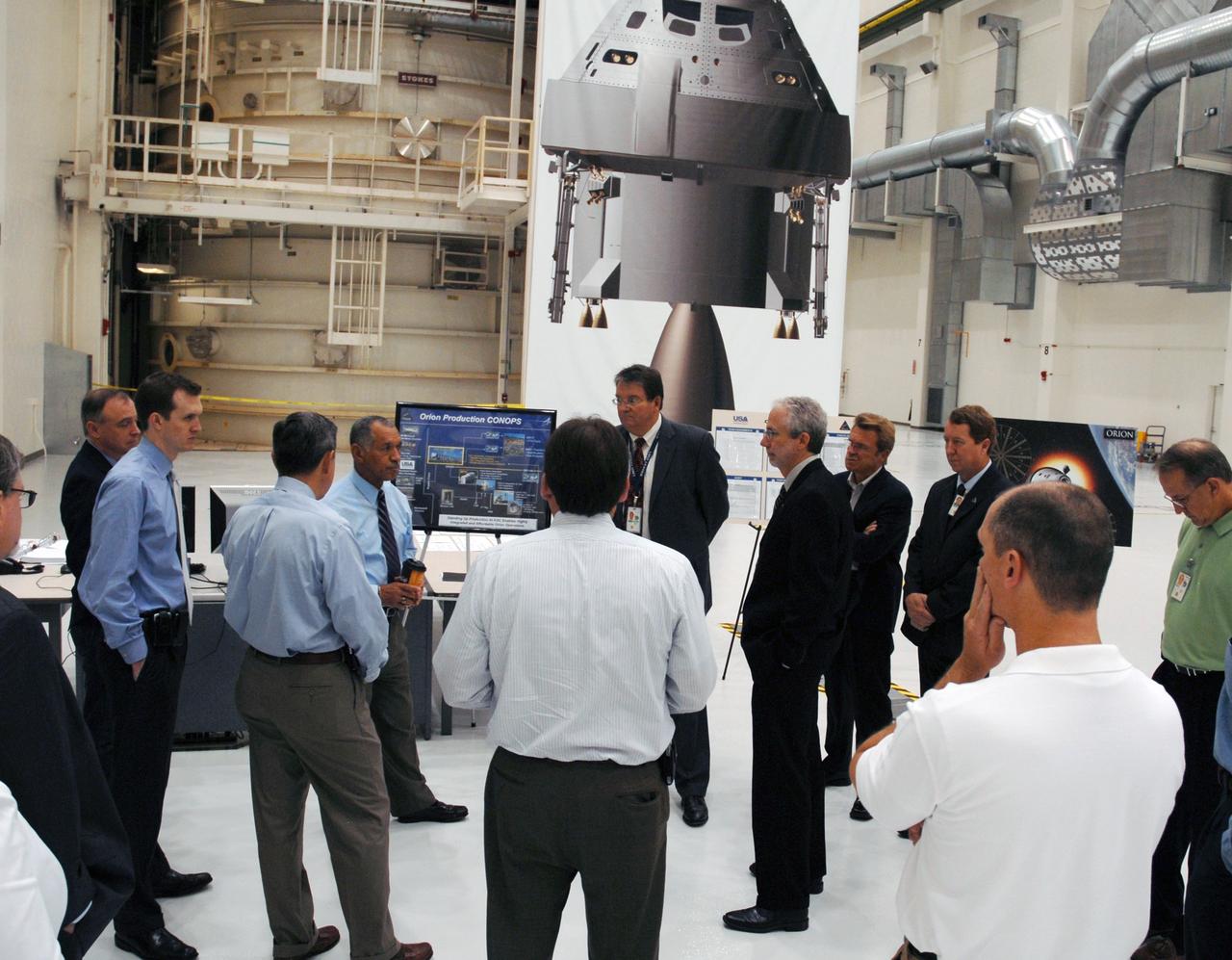 CAPE CANAVERAL, Fla. – On a tour of NASA's Kennedy Space Center in Florida, NASA Administrator Charles Bolden stops in the Operations and Checkout Building to view the high bay planned for the assembly of the Constellation Program's Orion crew vehicle.  At left are Chief of Staff in the Office of the Administrator George Whitesides, Center Director Bob Cabana (back to camera) and Bolden.  Facing Bolden is Lockheed Martin Space Systems Company Deputy Program Manager Richard F. Harris. Bolden is touring several facilities at Kennedy involved with NASA's  Constellation Program. Bolden also was at Kennedy for several events, including the landing of space shuttle Endeavour's STS-127 mission and the signing of the joint NASA-Japan Aerospace Exploration Agency agreement defining the terms of cooperation between the agencies on the Global Precipitation Measurement, or GPM, mission.  Photo credit: NASA/Kim Shiflett