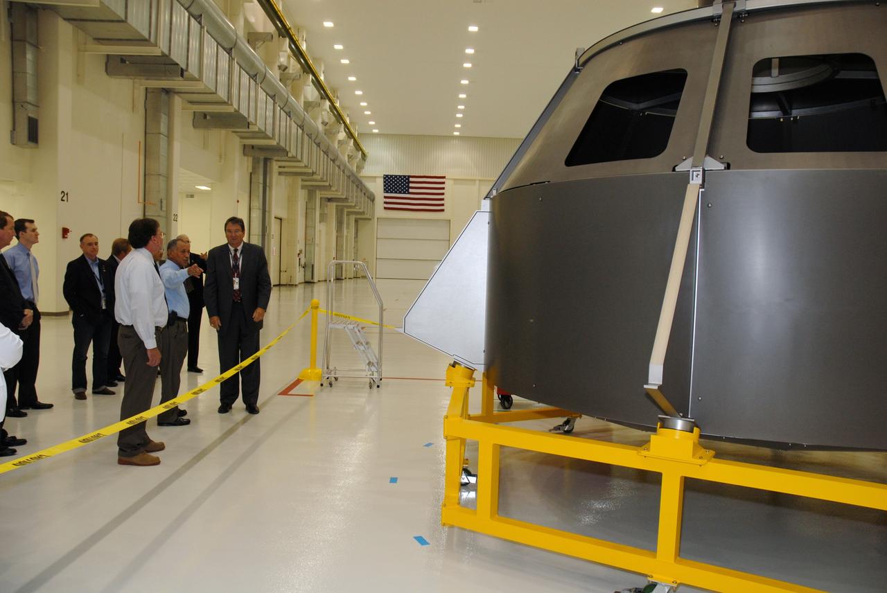CAPE CANAVERAL, Fla. – On a tour of NASA's Kennedy Space Center in Florida, NASA Administrator Charles Bolden (pointing, at left) stops in the Operations and Checkout Building to view the high bay planned for the assembly of the Constellation Program's Orion crew vehicle (seen at right).  On the right is Lockheed Martin Space Systems Company Deputy Program Manager Richard F. Harris. Bolden is touring several facilities at Kennedy involved with NASA's  Constellation Program. Bolden also was at Kennedy for several events, including the landing of space shuttle Endeavour's STS-127 mission and the signing of the joint NASA-Japan Aerospace Exploration Agency agreement defining the terms of cooperation between the agencies on the Global Precipitation Measurement, or GPM, mission.  Photo credit: NASA/Kim Shiflett
