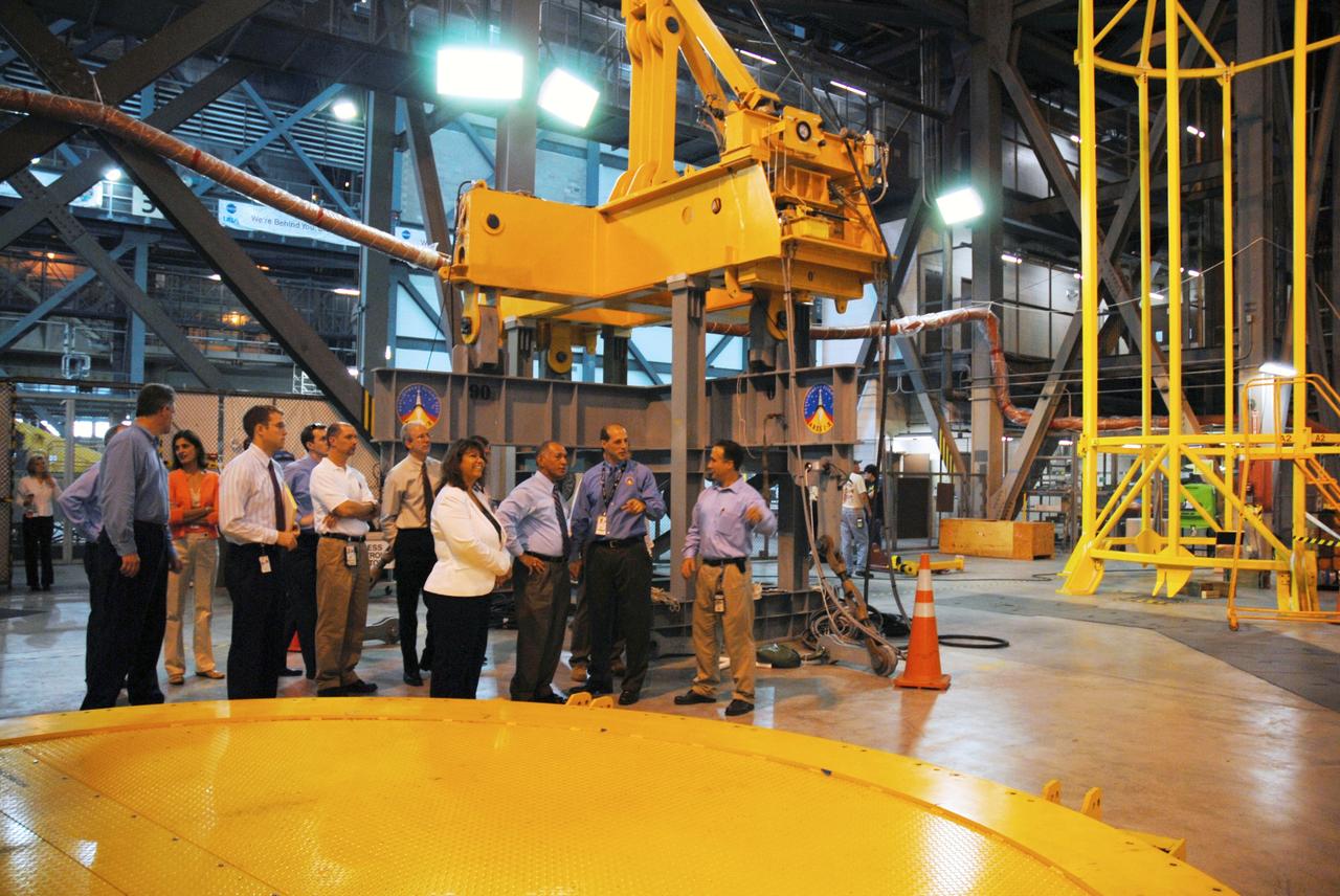 CAPE CANAVERAL, Fla. – At NASA's Kennedy Space Center in Florida, NASA Administrator Charles Bolden (third from right) is informed about Ares I-X operations in the Vehicle Assembly Building's High Bay 4. Bolden is touring several facilities at Kennedy involved with NASA's  Constellation Program.  Bolden also was at Kennedy for several events, including the landing of space shuttle Endeavour's STS-127 mission and the signing of the joint NASA-Japan Aerospace Exploration Agency agreement defining the terms of cooperation between the agencies on the Global Precipitation Measurement, or GPM, mission.  Photo credit: NASA/Kim Shiflett
