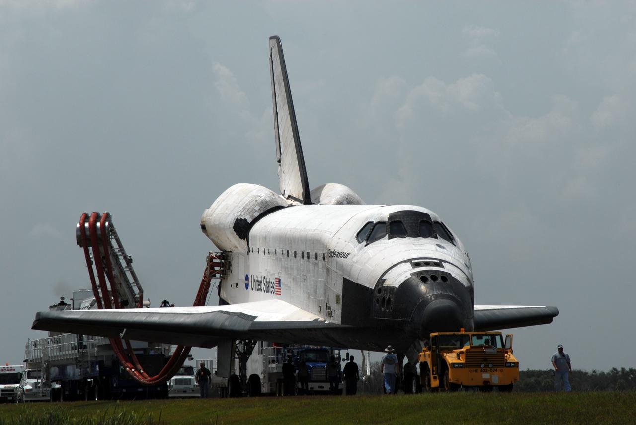 CAPE CANAVERAL, Fla. – At NASA's Kennedy Space Center in Florida, space shuttle Endeavour is towed away from the Shuttle Landing Facility.  It is being taken to the Orbiter Processing Facility #2.  Endeavour landed at 10:48 a.m. EDT, completing a journey of 6.5-million miles  on the STS-127 mission. Towing normally begins within four hours after landing and is completed within six hours unless removal of time-sensitive experiments is required on the runway. In the OPF, turnaround processing procedures on Endeavour will include various post-flight deservicing and maintenance functions, which are carried out in parallel with payload removal and the installation of equipment needed for the next mission. The STS-127 mission was the 29th flight to the station, the 23rd flight of Endeavour and the 71st landing at Kennedy.   Photo credit: NASA/Jim Grossmann