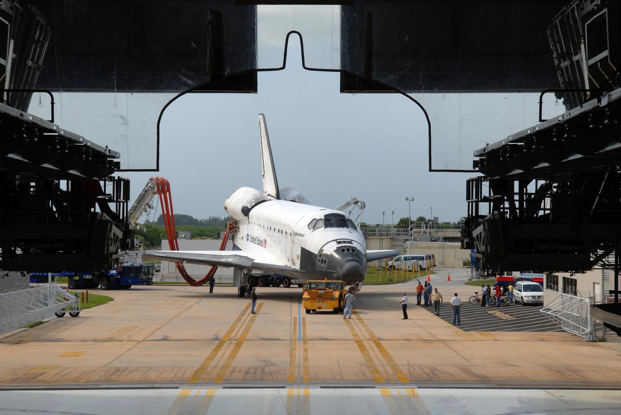 CAPE CANAVERAL, Fla. – At NASA's Kennedy Space Center in Florida, space shuttle Endeavour turns into Orbiter Processing Facility #2.  Endeavour landed at 10:48 a.m. EDT, completing a journey of 6.5-million miles  on the STS-127 mission. Umbilicals are still attached to purge the vehicle of any possible residual explosive or toxic fumes. Towing normally begins within four hours after landing and is completed within six hours unless removal of time-sensitive experiments is required on the runway. In the OPF, turnaround processing procedures on Endeavour will include various post-flight deservicing and maintenance functions, which are carried out in parallel with payload removal and the installation of equipment needed for the next mission. The STS-127 mission was the 29th flight to the station, the 23rd flight of Endeavour and the 71st landing at Kennedy.   Photo credit: NASA/Jim Grossmann