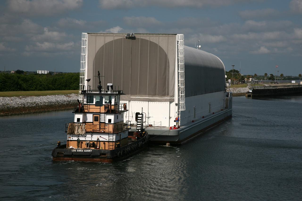 CAPE CANAVERAL, Fla. – NASA's Pegasus barge is towed on the Banana River toward the Launch Complex 39 Area at NASA's Kennedy Space Center in Florida. The barge contains the external fuel tank designated ET-133 that will be used for space shuttle Atlantis' STS-129 mission.  After arrival at the Turn Basin dock, the tank will be offloaded and moved into the Vehicle Assembly Building. The tank was shipped aboard the Pegasus from NASA's Michould Assembly Facility near New Orleans. Pegasus was towed to Port Canaveral by the Freedom Star Retrieval Ship.  Photo credit: NASA/Troy Cryder