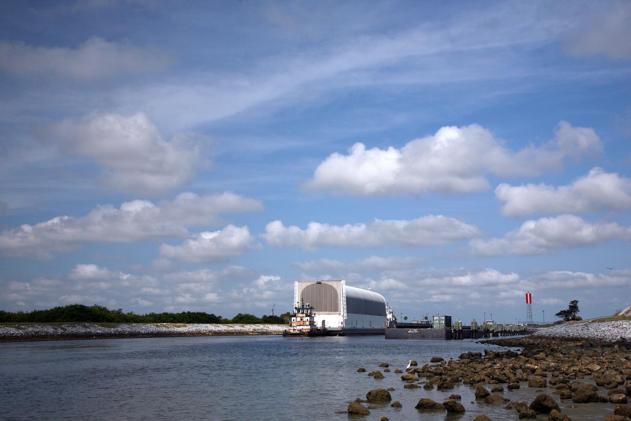 CAPE CANAVERAL, Fla. – NASA's Pegasus barge is towed on the Banana River toward the Launch Complex 39 Area at NASA's Kennedy Space Center in Florida. The barge contains the external fuel tank designated ET-133 that will be used for space shuttle Atlantis' STS-129 mission.  After arrival at the Turn Basin dock, the tank will be offloaded and moved into the Vehicle Assembly Building. The tank was shipped aboard the Pegasus from NASA's Michould Assembly Facility near New Orleans. Pegasus was towed to Port Canaveral by the Freedom Star Retrieval Ship.  Photo credit: NASA/Troy Cryder