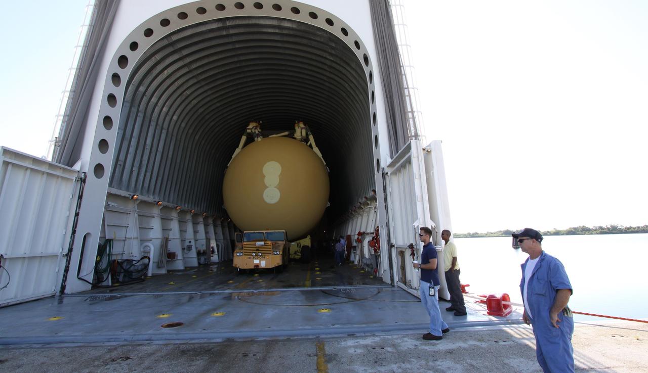 CAPE CANAVERAL, Fla. – Inside NASA's Pegasus barge at NASA's Kennedy Space Center in Florida is the external fuel tank designated ET-133 that will be used for space shuttle Atlantis' STS-129 mission. The tank will be unloaded and moved into a high bay in the Vehicle Assembly Building for checkout. The tank was shipped aboard the Pegasus from NASA's Michoud Assembly Facility near New Orleans. Pegasus was towed to Port Canaveral by the Freedom Star Retrieval Ship. Launch of Atlantis is targeted for November. Photo credit: NASA/Troy Cryder