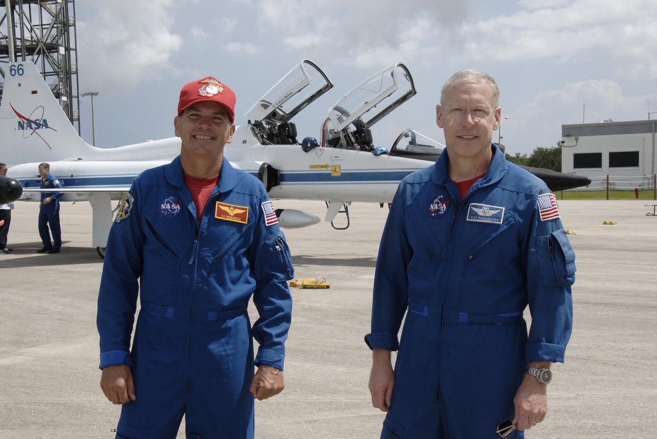 CAPE CANAVERAL, Fla. – Space shuttle Discovery's STS-128 mission crew members arrive in T-38 training jets at NASA Kennedy Space Center's Shuttle Landing Facility. Seen here are Commander Rick Sturckow and Mission Specialist Patrick Forrester. The astronauts will be taking part in terminal countdown demonstration test activities that include equipment familiarization and emergency egress training, and will culminate in a simulated launch countdown aboard Discovery. The mission will deliver a new crew member and 33,000 pounds of equipment to the International Space Station. The equipment includes science and storage racks, a freezer to store research samples, a new sleeping compartment and the COLBERT treadmill. Launch of Discovery is targeted for late August. Photo credit: NASA/Kim Shiflett