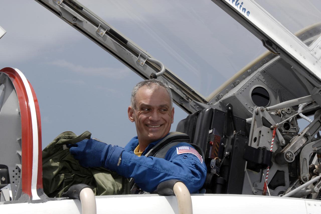 CAPE CANAVERAL, Fla. – Space shuttle Discovery's STS-128 mission crew members arrive in T-38 training jets at NASA Kennedy Space Center's Shuttle Landing Facility.  Mission Specialist John "Danny" Olivas is seen here.  The astronauts will be taking part in terminal countdown demonstration test activities that include equipment familiarization and emergency egress training, and will culminate in a simulated launch countdown aboard Discovery.  The mission will deliver a new crew member and 33,000 pounds of equipment to the International Space Station. The equipment includes science and storage racks, a freezer to store research samples, a new sleeping compartment and the COLBERT treadmill.  Launch of Discovery is targeted for late August. Photo credit: NASA/Kim Shiflett