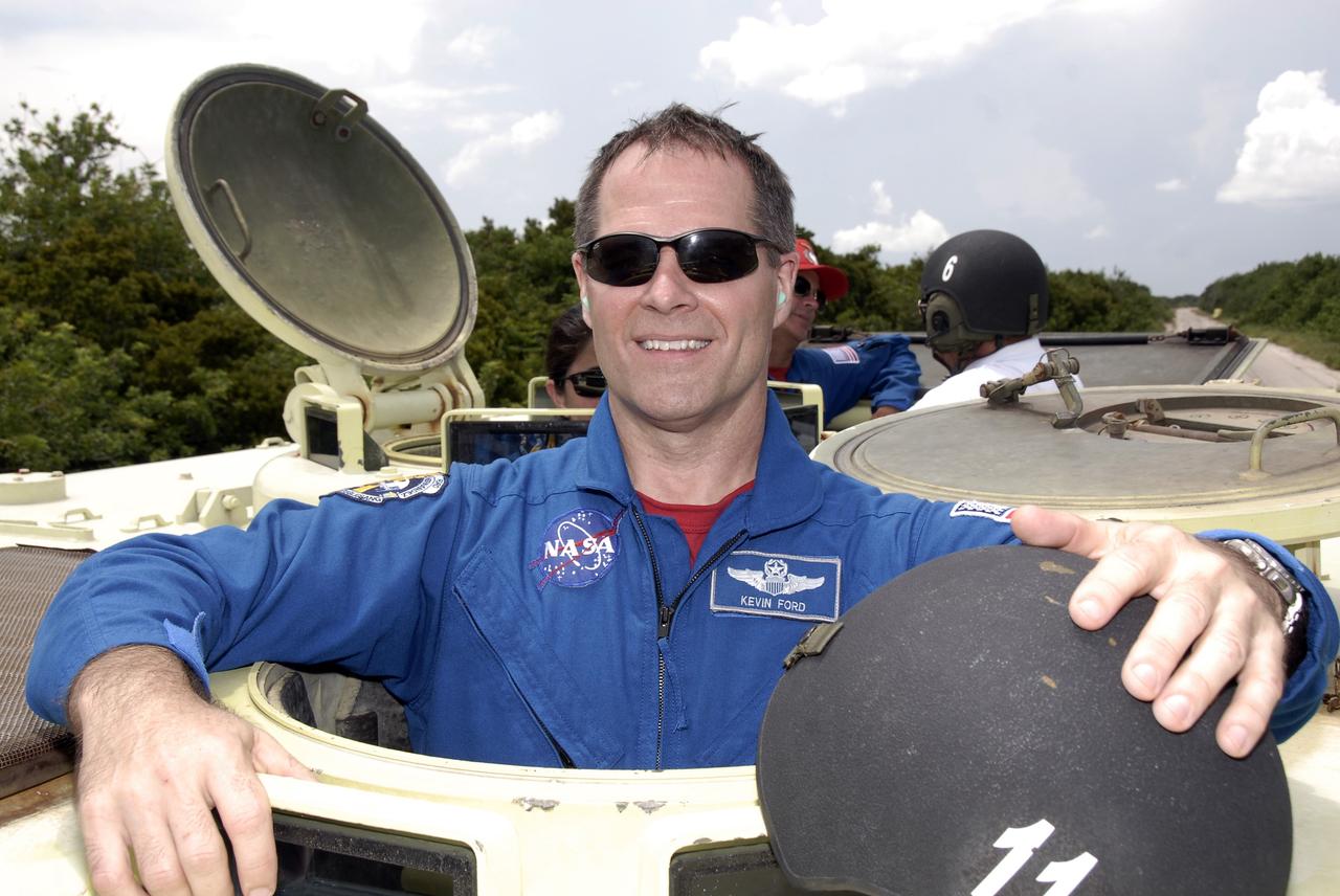 CAPE CANAVERAL, Fla. – At NASA's Kennedy Space Center in Florida, STS-128 Pilot Kevin Ford has completed his turn at driving an M-113 armored personnel carrier. The crew members of space shuttle Discovery's STS-128 mission are taking turns driving the M-113, which will be available to transport the crew to safety in the event of a contingency on the pad before their launch. The crew is at Kennedy for a launch dress rehearsal called the terminal countdown demonstration test, or TCDT, which includes emergency exit training and equipment familiarization, as well as a simulated launch countdown.  Launch of Discovery is targeted for late August. Photo credit: NASA/Kim Shiflett