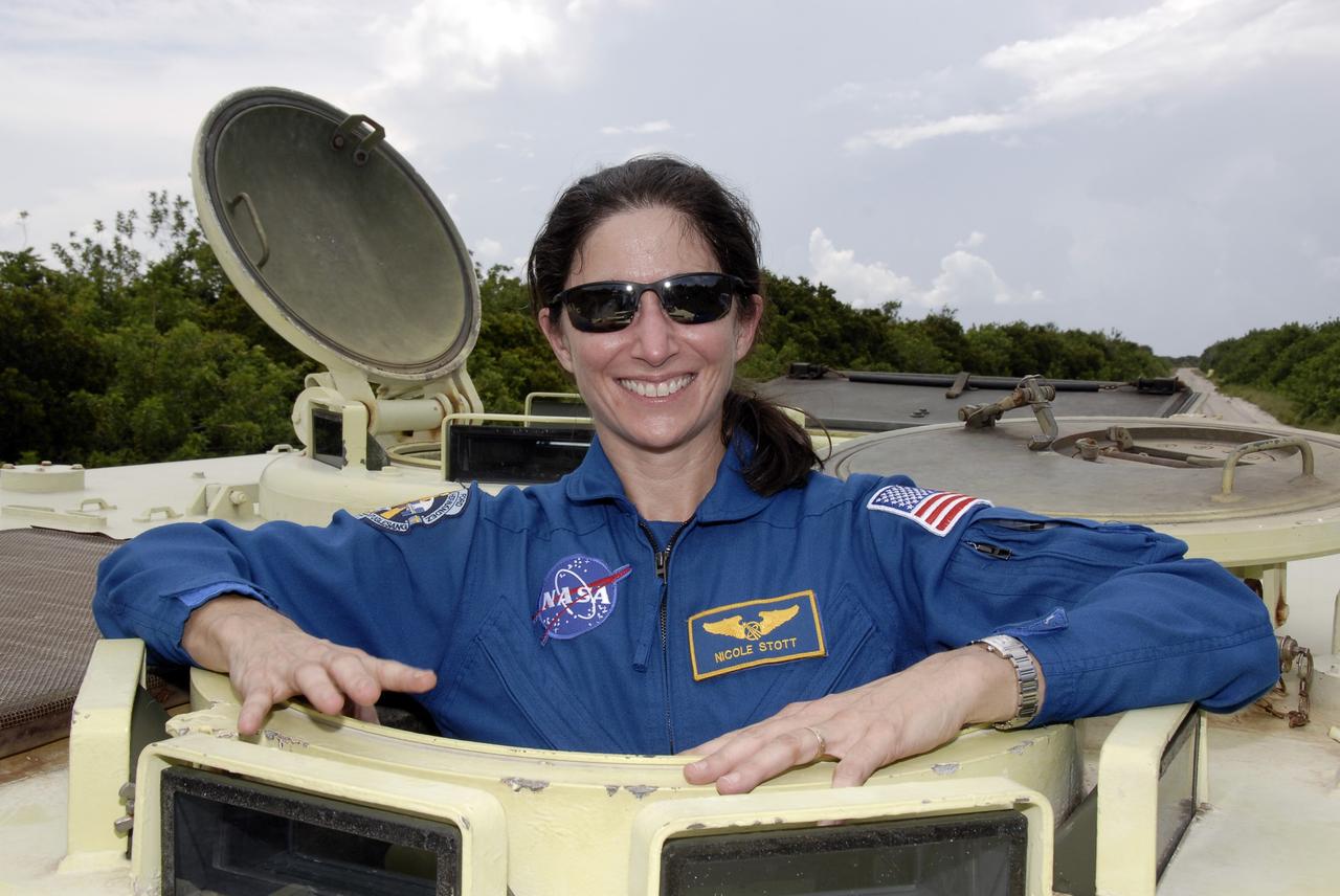 CAPE CANAVERAL, Fla. – At NASA's Kennedy Space Center in Florida, STS-128 Mission Specialist Nicole Stott has completed her turn at driving an M-113 armored personnel carrier. The crew is at Kennedy for a launch dress rehearsal called the terminal countdown demonstration test, or TCDT, which includes emergency exit training and equipment familiarization, as well as a simulated launch countdown.  Launch of Discovery is targeted for late August. Photo credit: NASA/Kim Shiflett