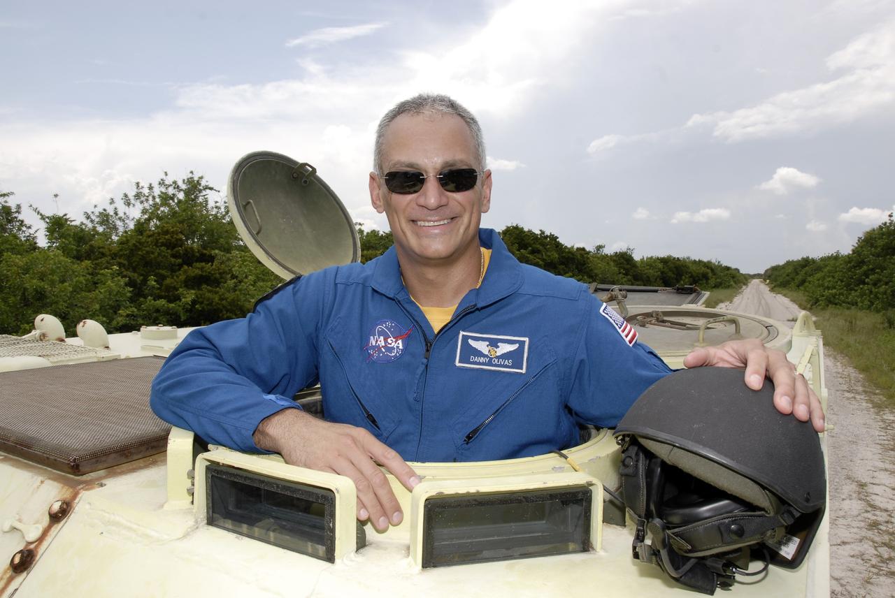 CAPE CANAVERAL, Fla. – At NASA's Kennedy Space Center in Florida, STS-128 Mission Specialist John "Danny" Olivas has completed his turn driving an M-113 armored personnel carrier.  The crew is at Kennedy for a launch dress rehearsal called the terminal countdown demonstration test, or TCDT, which includes emergency exit training and equipment familiarization, as well as a simulated launch countdown.  Launch of Discovery is targeted for late August. Photo credit: NASA/Kim Shiflett