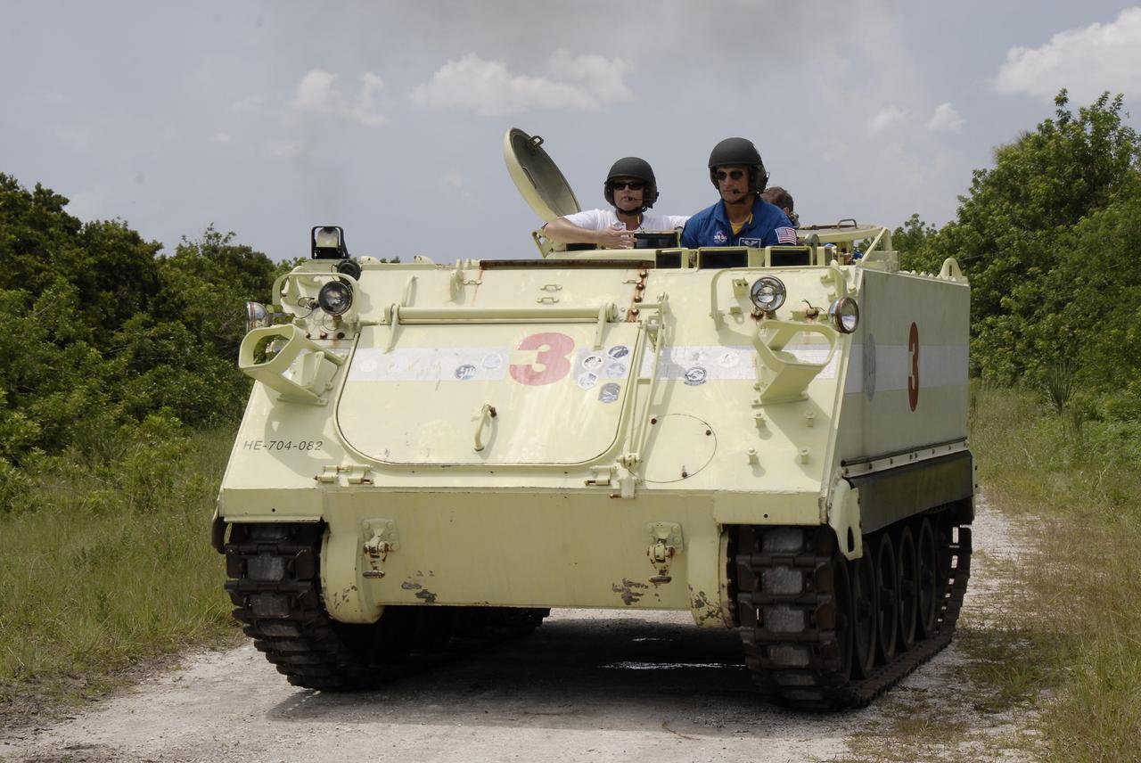 CAPE CANAVERAL, Fla. – At NASA's Kennedy Space Center in Florida, STS-128 Mission Specialist John "Danny" Olivas  takes his turn driving an M-113 armored personnel carrier.  The crew is at Kennedy for a launch dress rehearsal called the terminal countdown demonstration test, or TCDT, which includes emergency exit training and equipment familiarization, as well as a simulated launch countdown.  Launch of Discovery is targeted for late August. Photo credit: NASA/Kim Shiflett