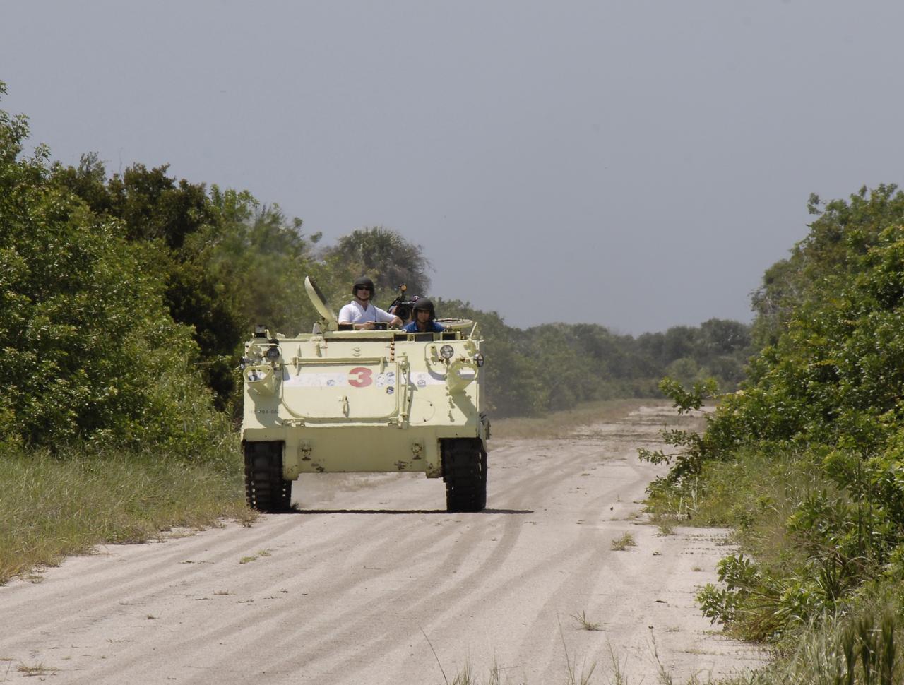 CAPE CANAVERAL, Fla. – At NASA's Kennedy Space Center in Florida, STS-128 Mission Specialist Christer Fuglesang takes his turn driving an M-113 armored personnel carrier. Fuglesang represents the European Space Agency.  The crew is at Kennedy for a launch dress rehearsal called the terminal countdown demonstration test, or TCDT, which includes emergency exit training and equipment familiarization, as well as a simulated launch countdown.  Launch of Discovery is targeted for late August. Photo credit: NASA/Kim Shiflett