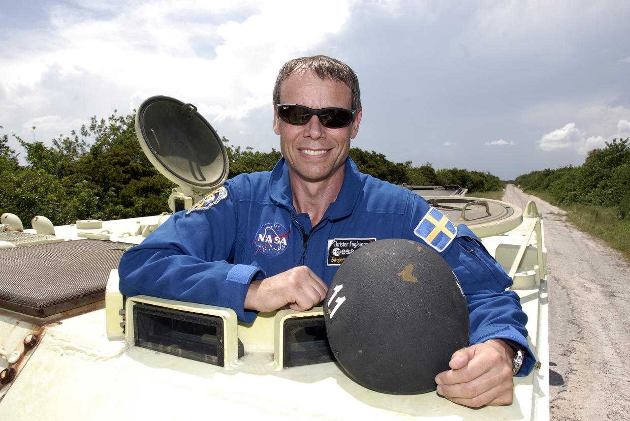 CAPE CANAVERAL, Fla. – At NASA's Kennedy Space Center in Florida, STS-128 Mission Specialist Christer Fuglesang has completed his turn driving an M-113 armored personnel carrier. Fuglesang represents the European Space Agency.  The crew is at Kennedy for a launch dress rehearsal called the terminal countdown demonstration test, or TCDT, which includes emergency exit training and equipment familiarization, as well as a simulated launch countdown.  Launch of Discovery is targeted for late August. Photo credit: NASA/Kim Shiflett