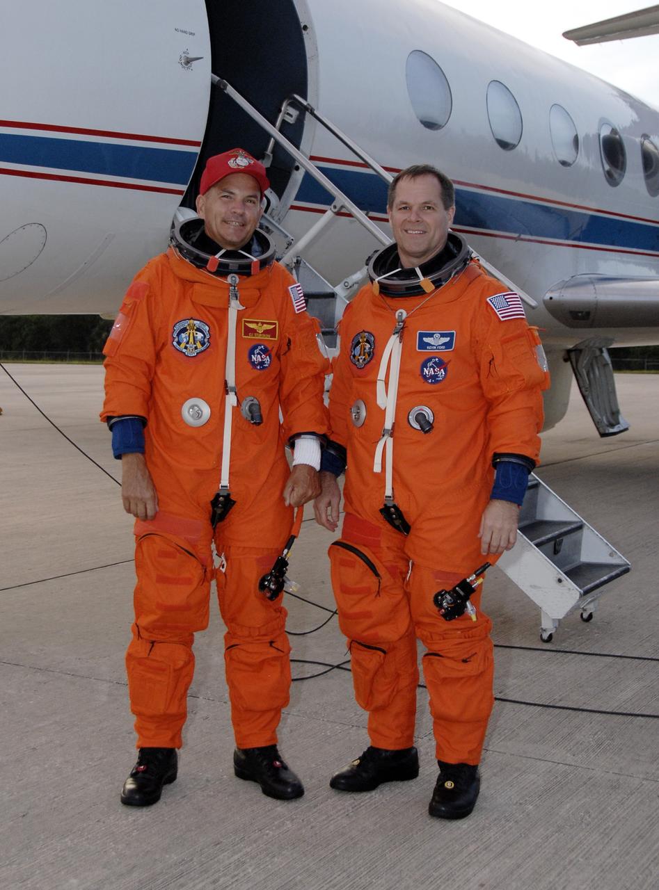 CAPE CANAVERAL, Fla. – At the Shuttle Landing Facility at NASA's Kennedy Space Center in Florida, STS-128 Commander Rick Sturckow (left) and Pilot Kevin Ford are ready to begin practicing shuttle landings in the Shuttle Training Aircraft, or STA.  The practice is in preparation for launch of space shuttle Discovery's STS-128 mission in late August to the International Space Station. The STA is a Grumman American Aviation-built Gulfstream II jet that was modified to simulate a shuttle’s cockpit, motion and visual cues, and handling qualities. The STS-128 crew is at Kennedy for a launch dress rehearsal called the terminal countdown demonstration test, or TCDT, which includes emergency exit training and equipment familiarization, as well as a simulated launch countdown.  Discovery will deliver 33,000 pounds of equipment to the station, including science and storage racks, a freezer to store research samples, a new sleeping compartment and the COLBERT treadmill. Photo credit: NASA/Kim Shiflett
