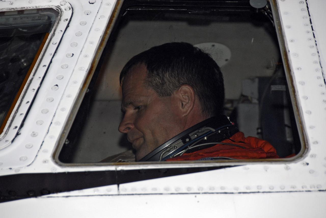CAPE CANAVERAL, Fla. –At the Shuttle Landing Facility at NASA's Kennedy Space Center in Florida, STS-128 Pilot Kevin Ford settles in the cockpit of the Shuttle Training Aircraft, or STA, to practice shuttle landings. The practice is in preparation for launch of space shuttle Discovery's STS-128 mission in late August to the International Space Station. The STA is a Grumman American Aviation-built Gulfstream II jet that was modified to simulate a shuttle’s cockpit, motion and visual cues, and handling qualities. The STS-128 crew is at Kennedy for a launch dress rehearsal called the terminal countdown demonstration test, or TCDT, which includes emergency exit training and equipment familiarization, as well as a simulated launch countdown.  Discovery will deliver 33,000 pounds of equipment to the station, including science and storage racks, a freezer to store research samples, a new sleeping compartment and the COLBERT treadmill. Photo credit: NASA/Kim Shiflett