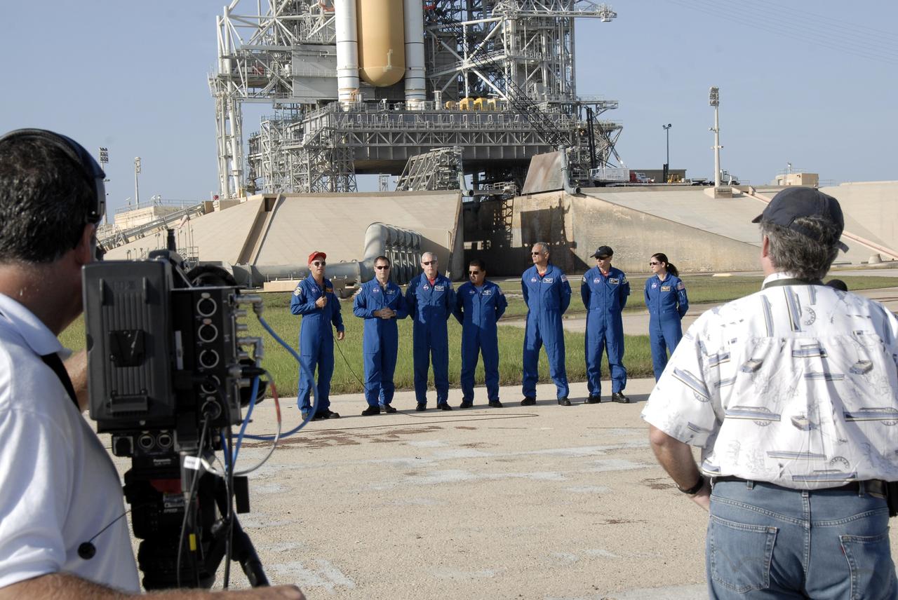 CAPE CANAVERAL, Fla. – Near Launch Pad 39A at NASA's Kennedy Space Center in Florida, STS-128 Commander Rick Sturckow, at left with the microphone, introduces the rest of the crew: from left, Pilot Kevin Ford and Mission Specialists Patrick Forrester, Jose Hernandez, John "Danny" Olivas, Christer Fuglesang and Nicole Stott.  Fuglesang represents the European Space Agency.  Media in the foreground capture images and comments.  The crew is at Kennedy for a launch dress rehearsal called the terminal countdown demonstration test, or TCDT, which includes emergency exit training and equipment familiarization, as well as a simulated launch countdown.  Discovery will deliver 33,000 pounds of equipment to the station, including science and storage racks, a freezer to store research samples, a new sleeping compartment and the COLBERT treadmill. Photo credit: NASA/Kim Shiflett