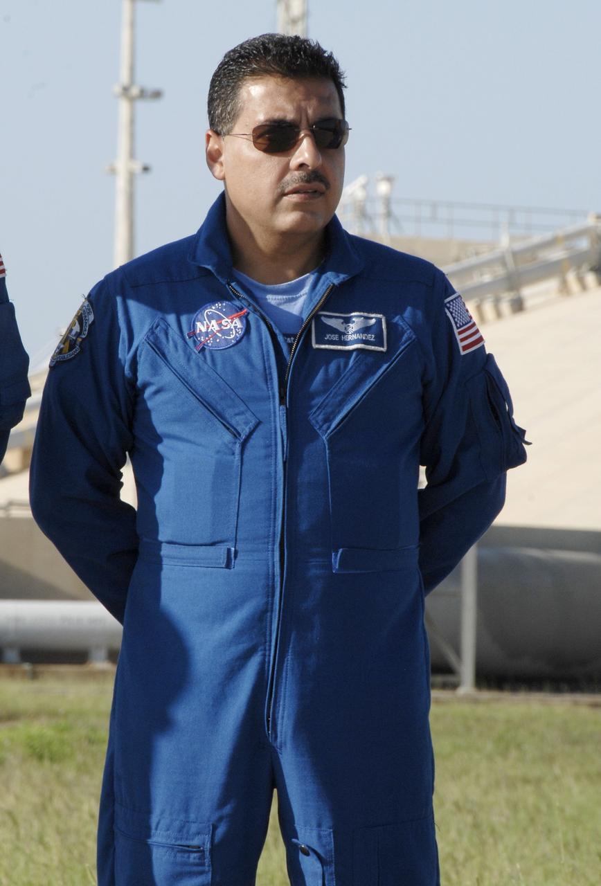 CAPE CANAVERAL, Fla. – At NASA's Kennedy Space Center in Florida, STS-128 Mission Specialist Jose Hernandez listens to a question from the media during a question-and-answer session near Launch Pad 39A. The crew is at Kennedy for a launch dress rehearsal called the terminal countdown demonstration test, or TCDT, which includes emergency exit training and equipment familiarization, as well as a simulated launch countdown.  Discovery will deliver 33,000 pounds of equipment to the station, including science and storage racks, a freezer to store research samples, a new sleeping compartment and the COLBERT treadmill. Photo credit: NASA/Kim Shiflett