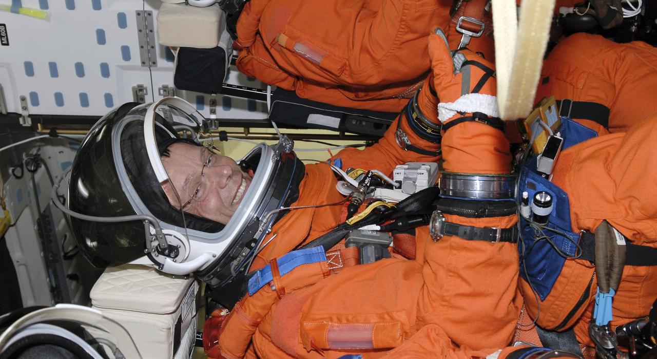 CAPE CANAVERAL, Fla. – Seated in space shuttle Discovery's cockpit on NASA Kennedy Space Center's Launch Pad 39A, STS-128 Mission Specialist Christer Fuglesang is glad to have completed the simulated launch countdown. He and other mission crew members are at Kennedy to take part in the terminal countdown demonstration test, or TCDT, which includes emergency exit training and culminates in the simulated countdown. On the STS-128 mission, Discovery will deliver 33,000 pounds of equipment to the station, including science and storage racks, a freezer to store research samples, a new sleeping compartment and the COLBERT treadmill. Launch is targeted for late August. Photo credit: NASA/Kim Shiflett