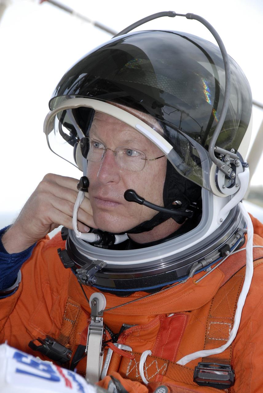 CAPE CANAVERAL, Fla. – After completing emergency exit practice from NASA Kennedy Space Center's fixed service structure, STS-128 Mission Specialist Patrick Forrester removes his helmet. Mission crew members are at Kennedy to take part in the terminal countdown demonstration test, or TCDT, which includes emergency exit training and culminates in the simulated countdown. On the STS-128 mission, Discovery will deliver 33,000 pounds of equipment to the station, including science and storage racks, a freezer to store research samples, a new sleeping compartment and the COLBERT treadmill. Launch is targeted for late August. Photo credit: NASA/Kim Shiflett