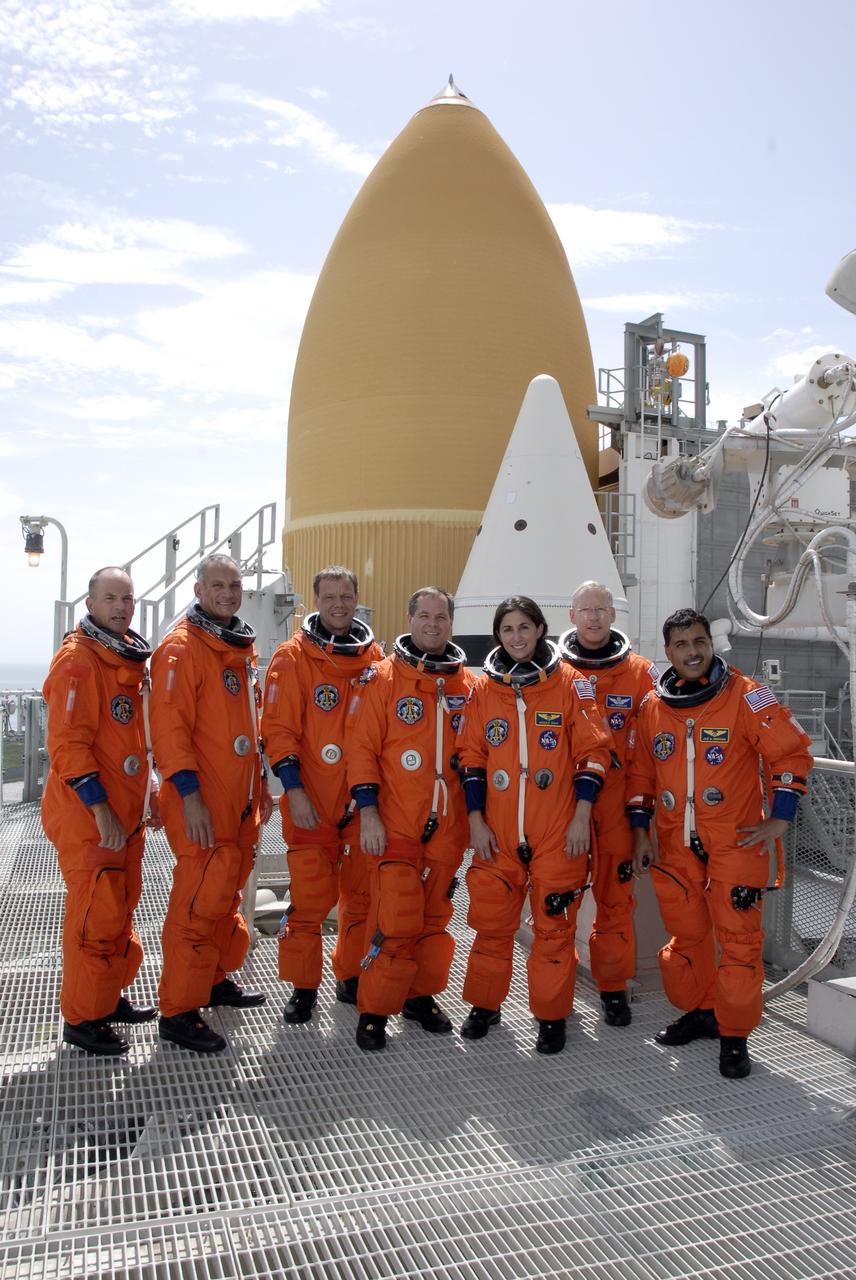 CAPE CANAVERAL, Fla. – The STS-128 crew members gather on the 225-foot level of NASA Kennedy Space Center's fixed service structure.  From left are Commander Rick Sturckow, Mission Specialists Danny Olivas and Christer Fuglesang, Pilot Kevin Ford and Mission Specialists Nicole Stott, Patrick Forrester and Jose Hernandez.  Mission crew members are at Kennedy to take part in the terminal countdown demonstration test, or TCDT, which includes emergency exit training and culminates in the simulated countdown. On the STS-128 mission, Discovery will deliver 33,000 pounds of equipment to the station, including science and storage racks, a freezer to store research samples, a new sleeping compartment and the COLBERT treadmill.  Launch is targeted for late August.   Photo credit: NASA/Kim Shiflett