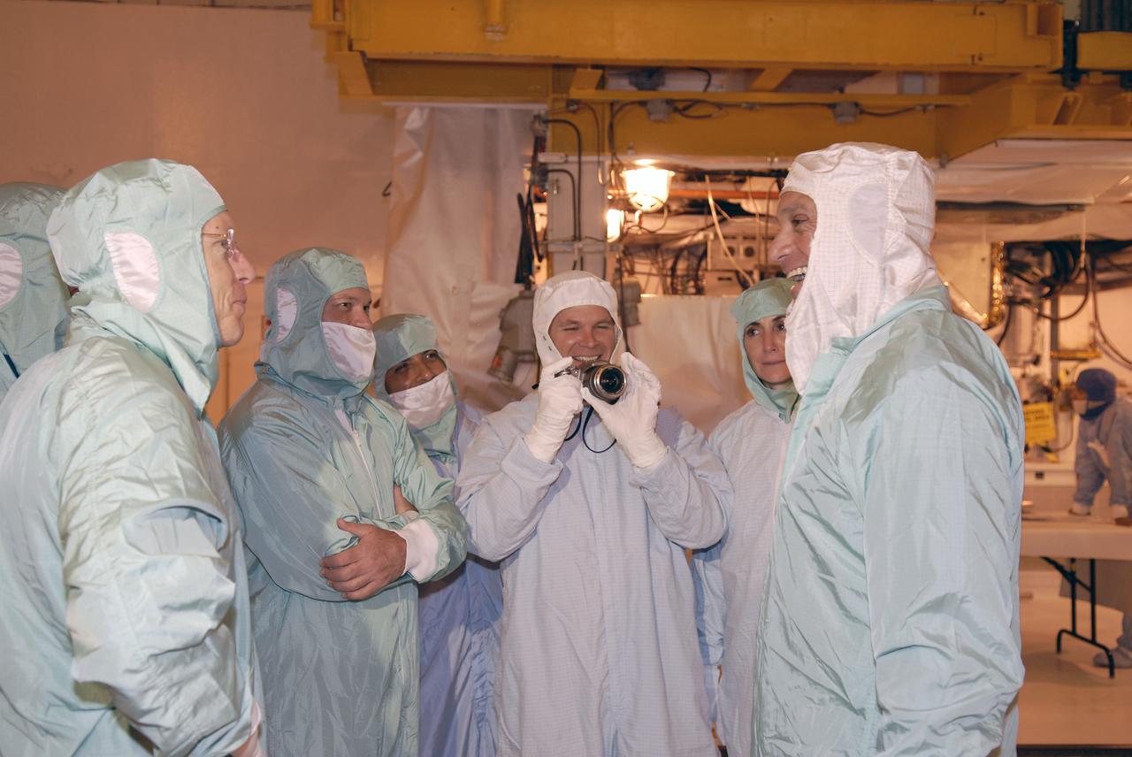 CAPE CANAVERAL, Fla. – In In the Payload Changeout Room on NASA Kennedy Space Center's Launch Pad 39A, STS-128 crew members relax after looking over the payloads to be installed in space shuttle Discovery. At left is Mission Specialist Patrick Forrester; at center is Pilot Kevin Ford; at right are Mission Specialists Nicole Stott and Danny Olivas.  The crew is at Kennedy to take part in the terminal countdown demonstration test, or TCDT, which includes equipment familiarization, emergency exit training and a simulated countdown. On the STS-128 mission, Discovery will deliver 33,000 pounds of equipment to the station, including science and storage racks, a freezer to store research samples, a new sleeping compartment and the COLBERT treadmill.  Launch is targeted for late August.  Photo credit: NASA/Kim Shiflett