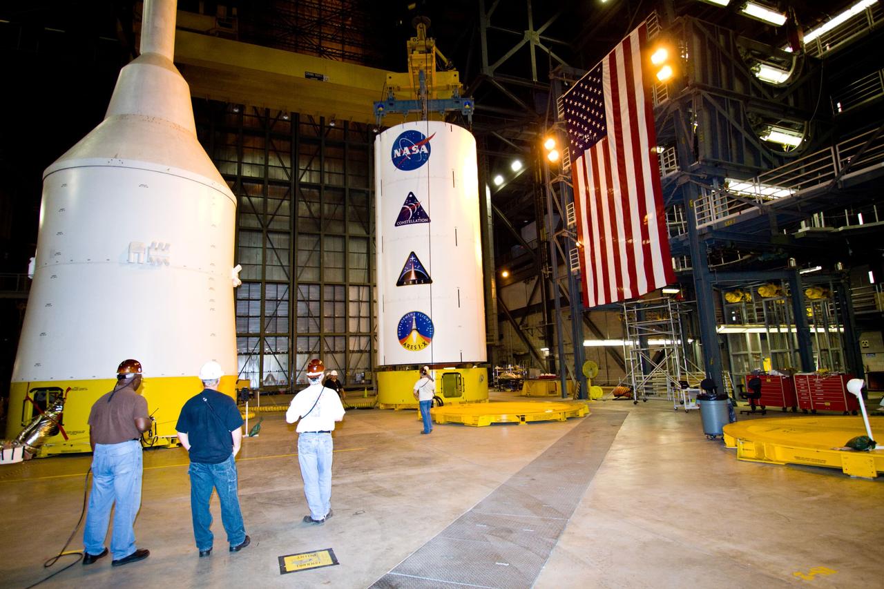 CAPE CANAVERAL, Fla. – In NASA Kennedy Space Center's Vehicle Assembly Building High Bay 3, a crane lifts the Ares I-X Super Stack 3 from its stand. The stack is being moved to High Bay 4 for integration with Super Stack 2. The upper stage comprises five super stacks, which are integrated with the four-segment solid rocket booster first stage on the mobile launch platform. Ares I-X is the test vehicle for the Ares I, which is part of the Constellation Program to return men to the moon and beyond. The Ares I-X flight test is targeted for Oct. 31, pending formal NASA Headquarters approval. Photo credit: NASA/Jack Pfaller