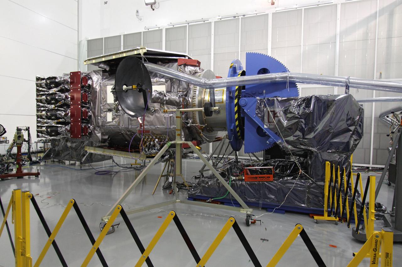 CAPE CANAVERAL, Fla. – At the Astrotech Space Operations facility in Titusville, Fla., the Solar Dynamics Observatory, or SDO, is undergoing performance testing.  The  high-gain antenna seen at center left will be moved, or gimbaled.  All of the spacecraft science instruments are being tested in their last major evaluation before launch.  SDO is the first space weather research network mission in NASA's Living With a Star Program.  The spacecraft's long-term measurements will give solar scientists in-depth information about changes in the sun's magnetic field and insight into how they affect Earth.  In preparation for launch, engineers will perform a battery of comprehensive tests to ensure SDO can withstand the stresses and vibrations of the launch itself, as well as what it will encounter in the space environment after launch.  Liftoff on an Atlas V rocket is scheduled for Dec. 4.  Photo credit: NASA/Jack Pfaller