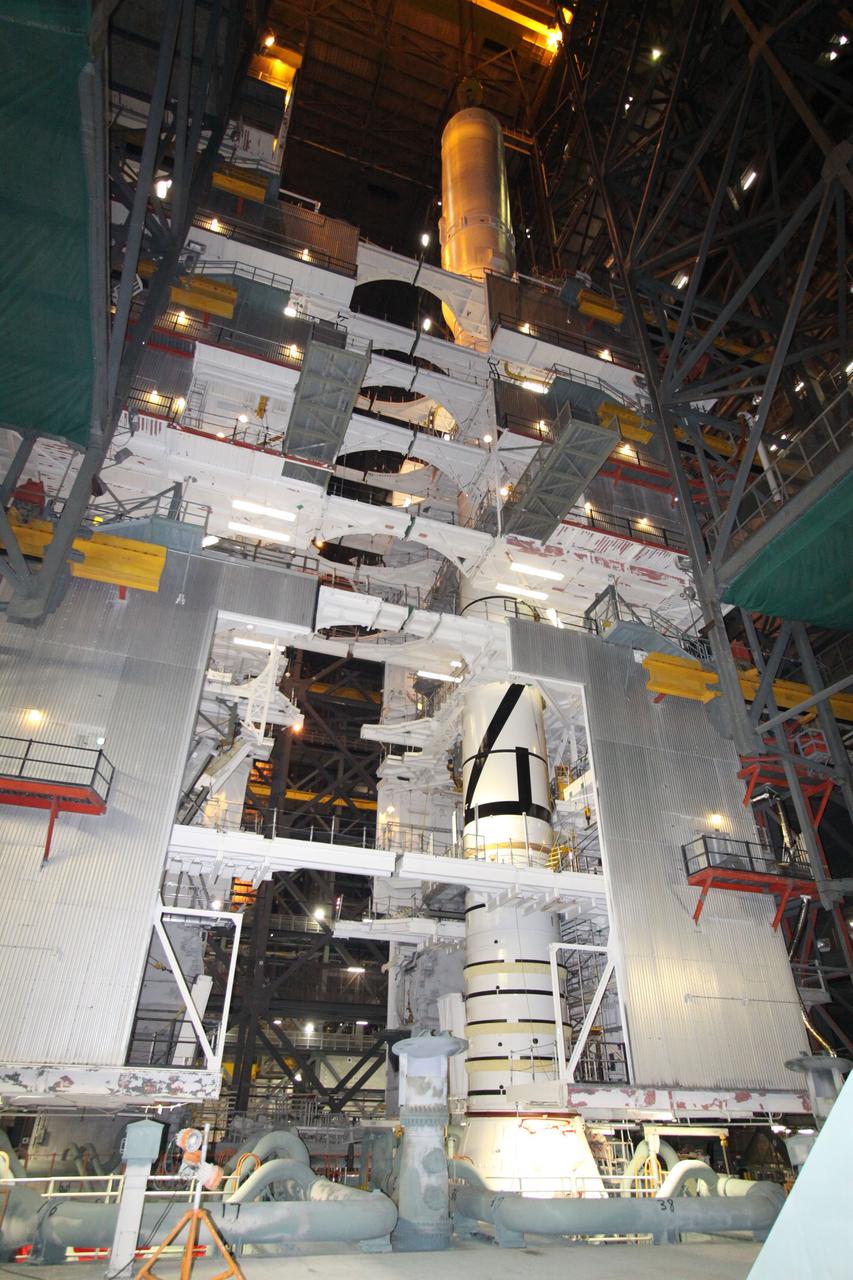 CAPE CANAVERAL, Fla. – In the Vehicle Assembly Building's High Bay 3, the Ares I-X rocket is being assembled on the mobile launcher platform.  Super Stack 4 has just been mated to Super Stack 3 on top.  Five super stacks make up the upper stage that will be integrated with the four-segment solid rocket booster first stage on the mobile launch platform.  Ares I-X is the test vehicle for the Ares I, which is part of the Constellation Program to return men to the moon and beyond. The Ares I-X flight test is targeted for  Oct. 31, pending formal NASA Headquarters approval. Photo credit: NASA/Jack Pfaller