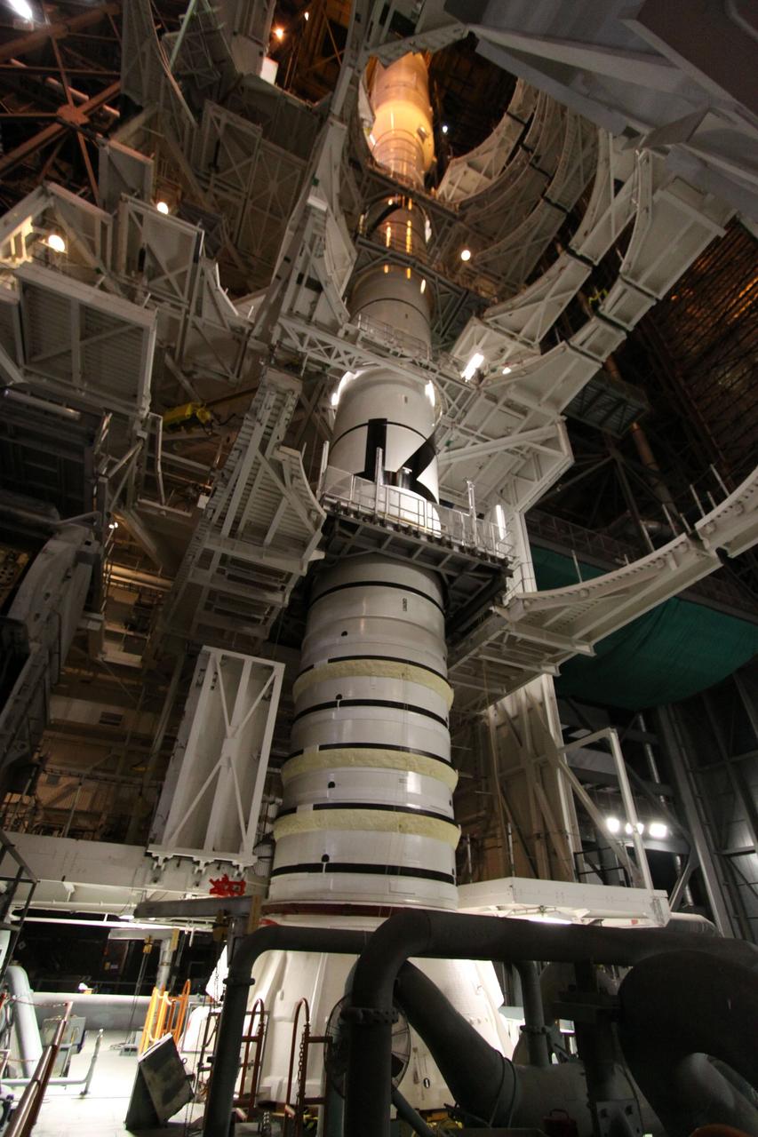 CAPE CANAVERAL, Fla. – In the Vehicle Assembly Building's High Bay 3, the Ares I-X rocket is being assembled on the mobile launcher platform.  Super Stack 4 has just been mated to Super Stack 3 on top.  Five super stacks make up the upper stage that will be integrated with the four-segment solid rocket booster first stage on the mobile launch platform.  Ares I-X is the test vehicle for the Ares I, which is part of the Constellation Program to return men to the moon and beyond. The Ares I-X flight test is targeted for  Oct. 31, pending formal NASA Headquarters approval. Photo credit: NASA/Jack Pfaller