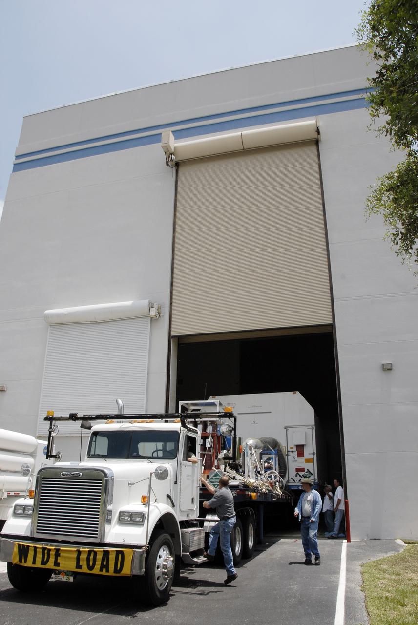 CAPE CANAVERAL, Fla. – The SV-1 cargo of the STSS Demonstrator spacecraft is moved into the Astrotech payload processing facility in Titusville, Fla. The spacecraft is a midcourse tracking technology demonstrator, part of an evolving ballistic missile defense system. STSS is capable of tracking objects after boost phase and provides trajectory information to other sensors. It will be launched by NASA for the Missile Defense Agency in late summer.  Photo credit: NASA/Kim Shiflett  (Approved for Public Release 09-MDA-4804 [4 Aug 09] )