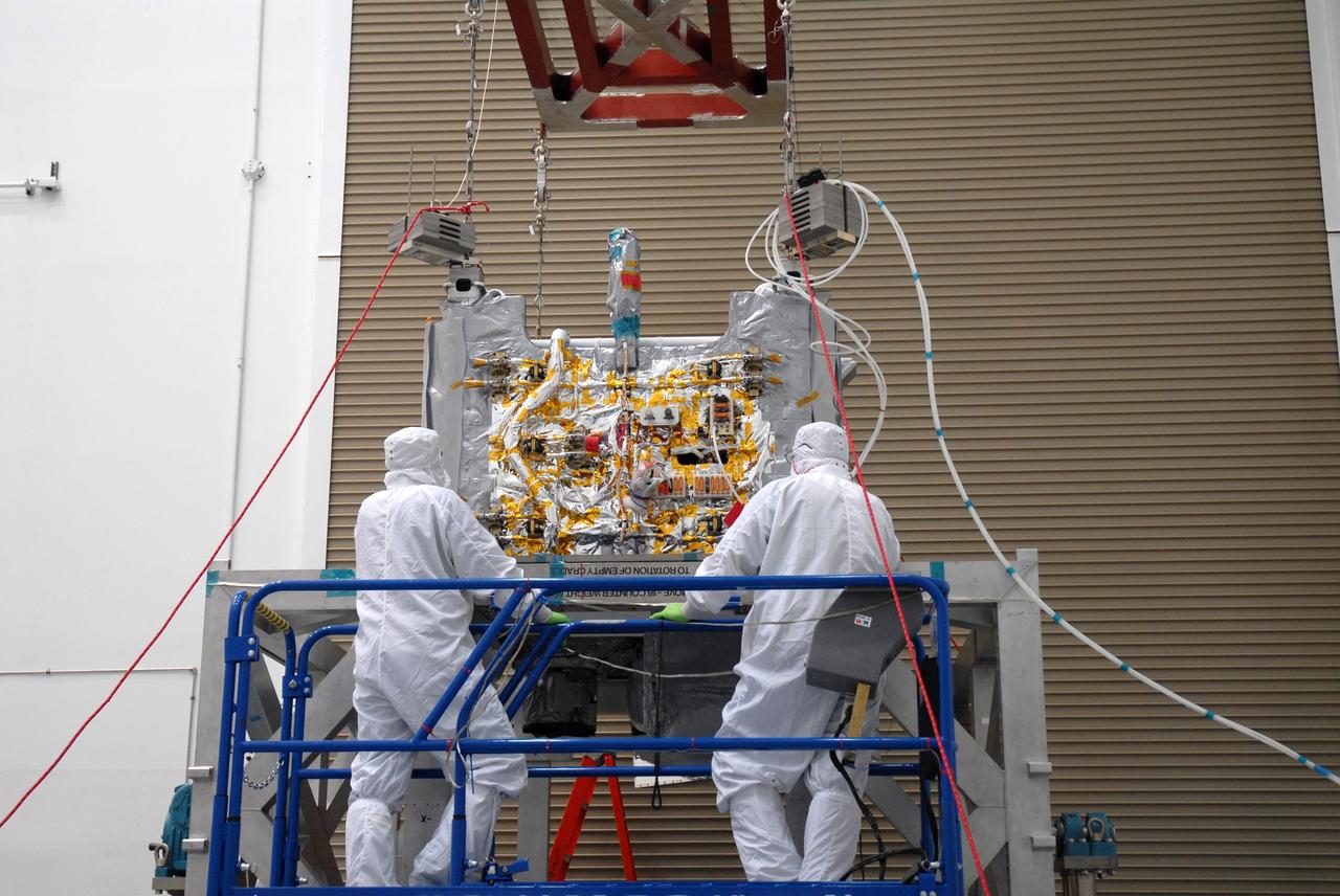 CAPE CANAVERAL, Fla. – In the Astrotech payload processing facility in Titusville, Fla. , the  STSS Demonstrator SV-1 spacecraft is lifted from its shipping crate.  The spacecraft is a midcourse tracking technology demonstrator, part of an evolving ballistic missile defense system. STSS is capable of tracking objects after boost phase and provides trajectory information to other sensors. It will be launched by NASA for the Missile Defense Agency in late summer.  Photo credit: NASA/Tim Jacobs  (Approved for Public Release 09-MDA-4800 [30 July 09] )